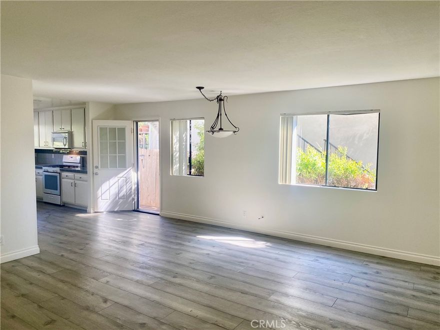 Enjoy Beach Living in the Heart of the Lantern District. Experience coastal charm on one of the most desirable streets. This lower level two-bedroom, two-bath home features a light and bright open floor plan with upgraded kitchen with a gas stove. The spacious living and dining area with laminate flooring opens up to a private backyard with a patio table and chairs for the exclusive use of tenants only, perfect for relaxing or entertaining outdoors.

The primary suite offers an en-suite bath with dual sinks, walk-in shower, and quartz counters. Enjoy the convenience of the direct access garage with epoxy flooring and washer/dryer hookups. Just minutes to Dana Point Harbor, beautiful beaches, and an array of shops and restaurants. Owner lives in the above unit and may consider one small quiet dog with additional rent. Tenants pays Gas & Electric. Ready for immediate occupancy.