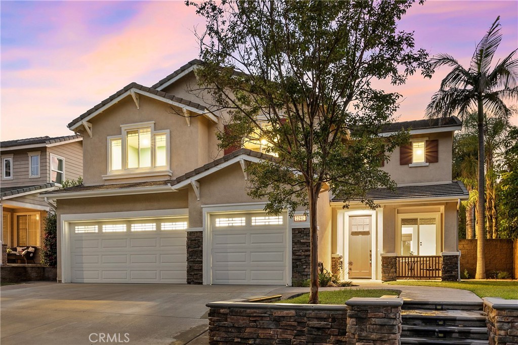 Tucked away at the end of a quiet cul-de-sac in the desirable Robinson Ranch community, this stunning 5–6 bedroom, 3-bathroom home offers nearly 3,000 square feet of expansive living space, combining comfort, functionality, and scenic beauty in one remarkable package.
Step inside and immediately feel the warmth of this thoughtfully designed layout—where formal and casual spaces flow seamlessly. Soaring ceilings and large windows flood the home with natural light and frame peaceful mountain views that bring a sense of calm to everyday living.
The inviting family room features rich wood-accented built-ins, a cozy fireplace, and custom niches—perfect for relaxing or entertaining. Nearby, the formal living and dining rooms offer ample room for hosting gatherings with elegance and ease. At the center of it all, the chef-inspired kitchen impresses with granite countertops, custom cabinetry, a large center island with breakfast bar seating, a walk-in pantry, and stylish stone finishes. The adjacent breakfast nook overlooks the backyard, making mornings feel extra special. A flexible downstairs room—ideal as a home office or sixth bedroom—adds versatility for guests or evolving household needs.
Upstairs, the spacious primary suite feels like a private getaway, with sweeping views, recessed lighting, and a spa-like en-suite bath featuring a frameless glass shower, soaking tub, and dual vanities. Four additional bedrooms plus a large loft offer plenty of space for family, guests, or hobbies. Outside, enjoy effortless entertaining on the beautifully hardscaped patio, complete with stone-wrapped columns, a firepit for cool evenings, and low-maintenance turf for year-round greenery.
Living in Robinson Ranch means access to resort-style amenities, including a community pool and spa, playgrounds, BBQ areas, and miles of nearby trails. With close proximity to award-winning schools, parks, and golf courses, this home offers a lifestyle that’s as vibrant as it is peaceful.