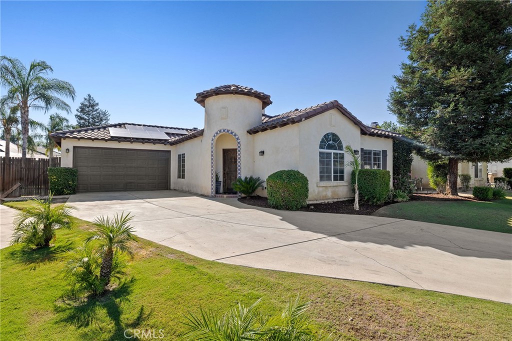 Welcome to this beautifully maintained Spanish-style gem in the desirable Stockdale Ranch community. Featuring a split-wing layout with 4 spacious bedrooms and 2 full bathrooms, this home blends character and comfort with thoughtful details throughout.Step inside to discover a two separate living spaces, highlighted by a cozy fireplace, perfect for both relaxation and entertaining.Retreat to the private primary suite, thoughtfully separated from the secondary bedrooms, offering peace and quiet at the end of the day. The split-wing design makes this layout ideal for families or those needing flexible living space.Out front, the oversized driveway provides ample parking, great for guests, extra vehicles, or even a small RV or trailer. The home's Spanish-style charm is accented with warm stucco finishes.