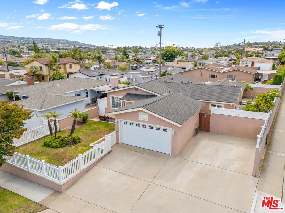 Perfectly located in one of South Torrance's most desirable neighborhoods! Very well-maintained and turn-key 4 bed, 2 bath home on large corner lot, less than two miles from the beach! Featuring a spacious living room, family room, dining room, two stone fireplaces, and hardwood flooring throughout. The kitchen is equipped with granite counters, breakfast bar, and stainless steel appliances. Recent upgrades include a Lennox HVAC system with updated ductwork, a newer water heater, new fixtures, and a 200-amp electrical panel. The primary suite includes a walk-in closet, private direct access to the backyard and deck, and recently renovated en-suite bath. The three secondary bedrooms are spacious and feature mirrored closet doors, with one of the bedrooms currently being used as an office. Beautifully landscaped and fenced lot, with large deck and sitting area. The attached two-car garage offers direct access, and the driveway provides space for RV or additional parking. Located in the best part of South Torrance - minutes from the Del Amo Center, the beach, and close to all 3 levels of distinguished South Torrance schools! A rare opportunity in a sought-after pocket of the South Bay!