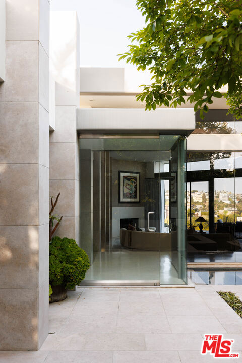A timeless modern affording a sophisticated lifestyle with views over LA providing a stunning backdrop. Walls of glass illuminate living spaces with natural light, accentuating architectural moments. A serene sanctuary, moments above the Sunset strip.