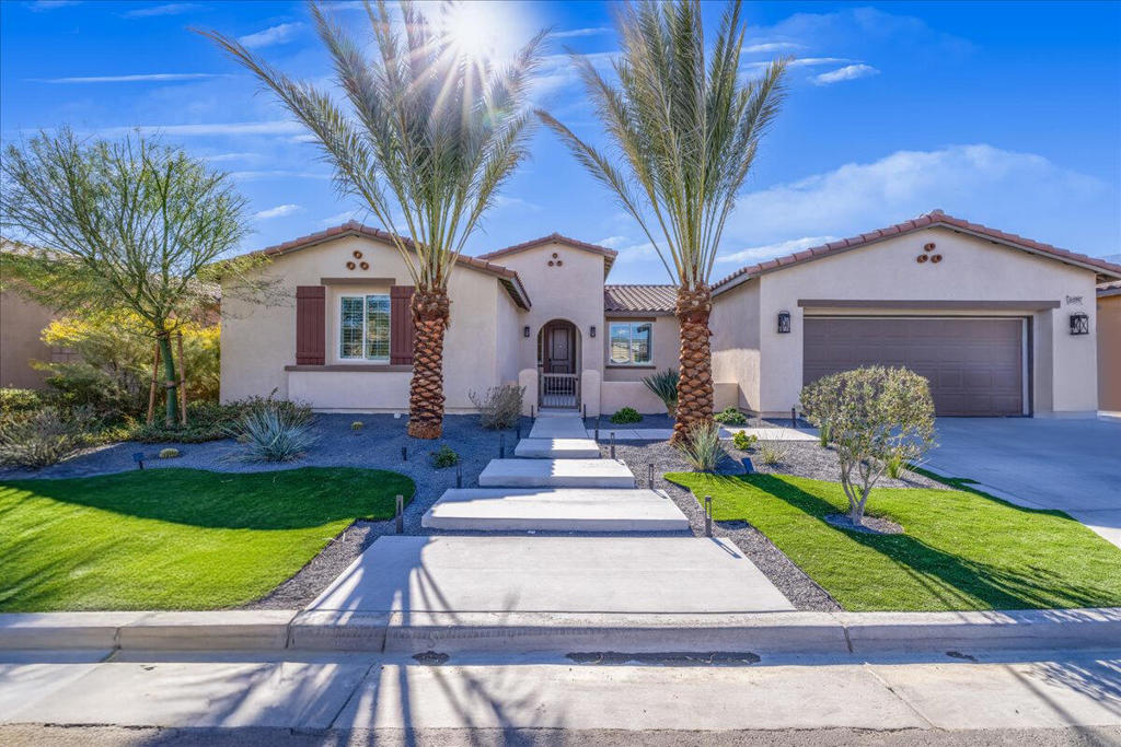 Discover the epitome of modern living in La Quinta with The Enclave at Capistrano. This remarkable new residence boasts 3bd/2.5 ba encompass 2,679 square ft of thoughtfully planned space tailored for the quintessential desert lifestyle and entertaining. As you approach, a charming courtyard invites you to enjoy serene moments of stargazing, savoring morning coffee, or immersing yourself in a captivating book. This home has been professionally decorated with over $120K in landscaping including palm trees, putting green, firepit, and more. The grand entrance flows seamlessly into a dem and an inviting formal Dining Room, leading into a spacious great room and a California Room--ideal for extending your gatherings into the south facing backyard. The gourmet Kitchen stands out with its upgraded cabinetry, sleek quartz countertops, stainless-steel appliances, and a generous island, complemented by a Butler's Pantry and a cozy dining nook. The expansive Primary Suite offers a luxurious retreat, featuring a stunning bathroom with a standalone soaking tub, a walk-in shower, dual vanity sinks with elegant stone counters, and spacious walk-in closets. Additionally, two well-appointed bedrooms share a stylish bathroom equipped with dual sinks. Enhanced by cutting-edge ''Americas Smart Home Technology,'' LED recessed lighting, and a tankless water heater, this home is designed for modern comfort and convenience. Experience the lifestyle you deserve where elegance meets innovation!