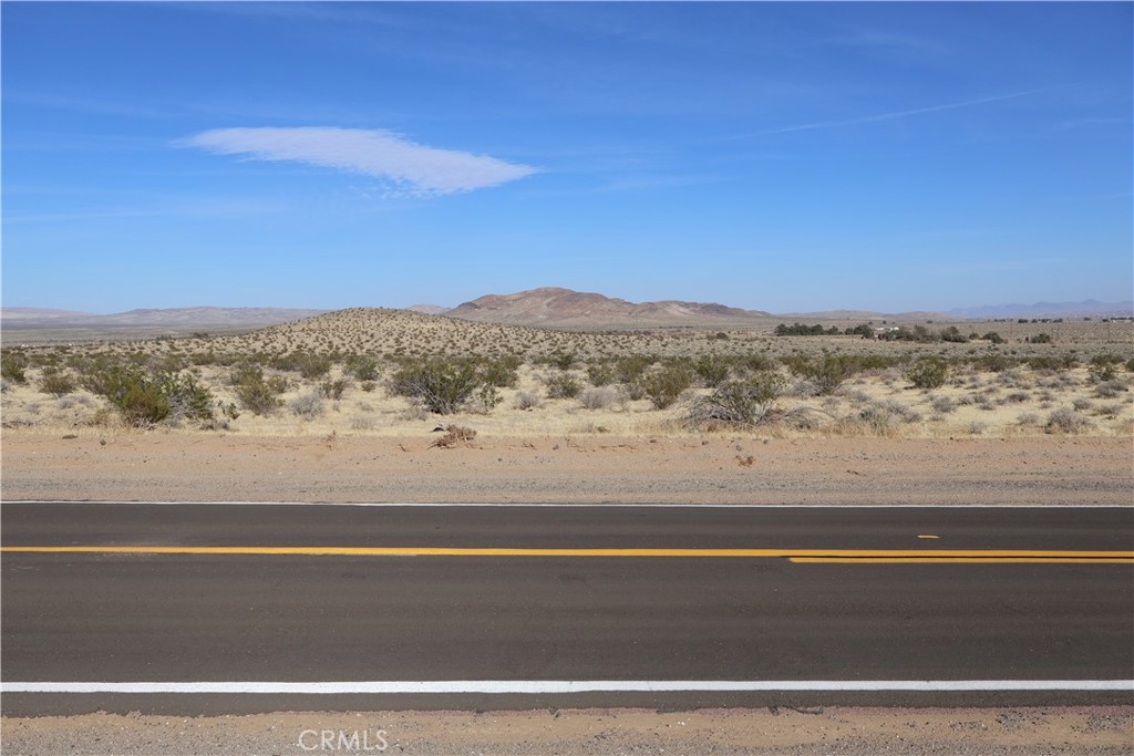 Become the owner of this 5 acre lot in Hinkley, Ca. One plus is that the property has a paved road and frontage which makes access to the property incredibly easy. No need for getting your car dirty on a dirt road, driving through other properties illegally, or having a rough and bumpy ride. Electricity is already across the street which gives this property another plus! Barstow International Gateway will be 5 miles away. The Barstow International Gateway will be an approximately 4,500-acre new integrated rail facility on the west side of Barstow, consisting of a rail yard, intermodal facility and warehouses for transloading freight from international containers to domestic containers. The new facility will bring thousands of direct jobs to California’s high desert communities, reduce highway and port congestion, and maximize rail and distribution efficiency regionally and across the U.S. supply chain. Highway 58 is only 2.7 miles away. The zoning of this land (RL) is designed to preserve a rural character, with emphasis on open space, low densities, and areas suitable for outdoor recreation and potentially wildlife habitat.