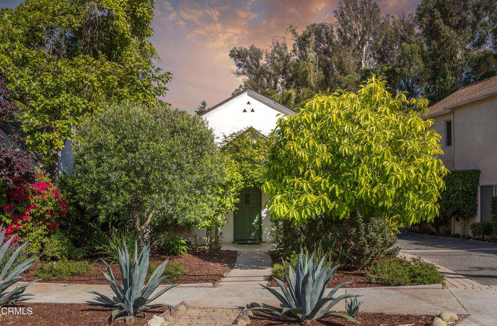 First time on the market in 23 years! This charming stand alone California Cottage blends old world charm with a modern flare. The home features two spacious bedrooms and 1 bathroom, formal dining room, cozy living room with fireplace, laundry room with new washer and dryer, beautiful wood floors, and a newly remodeled vibrant kitchen with quartz countertops, custom cabinetry, high end appliances, LVP flooring, and a breakfast nook. As you step into the backyard, enjoy the recently built patio deck, and ample stone patio for outdoor leisure, complimented by an electric awning. The oversized two car garage has been updated with newer flooring and plenty of storage space, perfect for a gym, office, or a spacious extra family room. New roof was installed just two years ago along with Solar panels (owned)! Don't miss out on this incredible opportunity to own this stand alone home, part of only a 3 unit condominium complex, located in an ideal and quiet location!