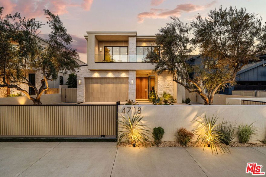 Be the first to live in this brand new 2025 contemporary masterpiece by MLR Development, celebrated for exceptional design, craftsmanship, and attention to detail. Located in the vibrant heart of Sherman Oaks, this thoughtfully designed four-bedroom, five-bathroom residence defines modern California living. Inside, soaring ceilings and expansive glass doors create seamless indoor-outdoor flow, while the open-concept layout enhances natural light throughout. The gourmet kitchen is a true showstopper, featuring Miele appliances, porcelain stone finishes, an oversized island with seating, and 35 feet of retractable glass doors that open to a private backyard. The dining room is anchored by a floating corner courtyard with a mature olive tree, creating the perfect setting for alfresco evenings. A main-level bedroom with private bath offers ideal flexibility for guests or a home office. Upstairs, three additional bedrooms each feature en-suite baths and balconies for maximum comfort and privacy. The upstairs laundry room includes custom cabinetry, marble counters, and a utility sink for convenience. The primary suite is a private sanctuary with abundant natural light by day and a cozy fireplace by night. The custom walk-in closet is expertly designed, while the spa-inspired bath features a soaking tub, dual vanities, and a walk-in dual shower. The backyard is an entertainer's dream, with a sparkling pool, spa, built-in barbeques and pizza oven, and lush privacy landscaping, perfect for relaxing or hosting in true California style. This fully integrated smart home blends technology, comfort, and sophistication. Located just moments from the shopping and dining of Ventura Boulevard, this never-lived-in residence offers a rare opportunity to lease a home that perfectly combines modern luxury and timeless design. Property is not furnished.