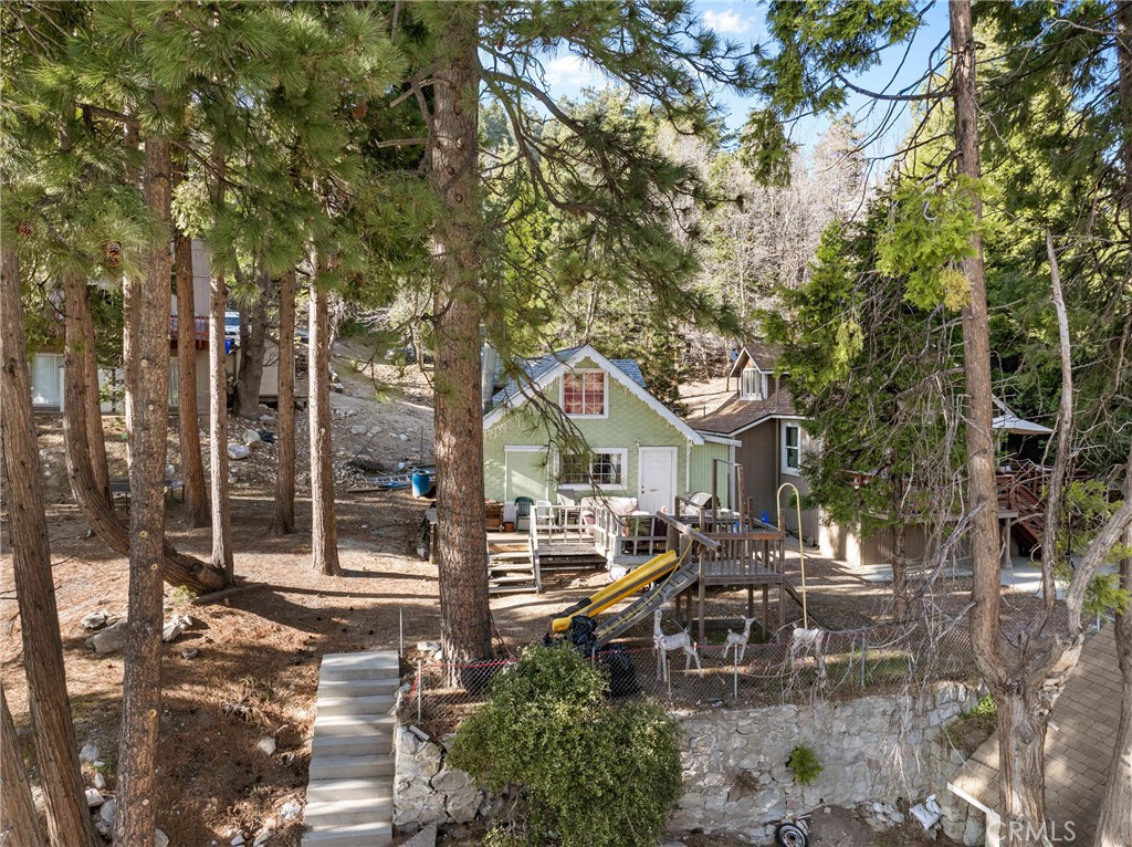 This 2-bedroom, 1-bathroom home offers 602 sq. ft. of cozy living space on a 3,000 sq. ft. lot. Located in the quiet community of Rimforest, this property is a great option for a weekend retreat, rental, or full-time mountain living. Just minutes from Lake Arrowhead, shopping, and local trails. With a little vision, this home could shine! Home comes with the lot next to it as well !