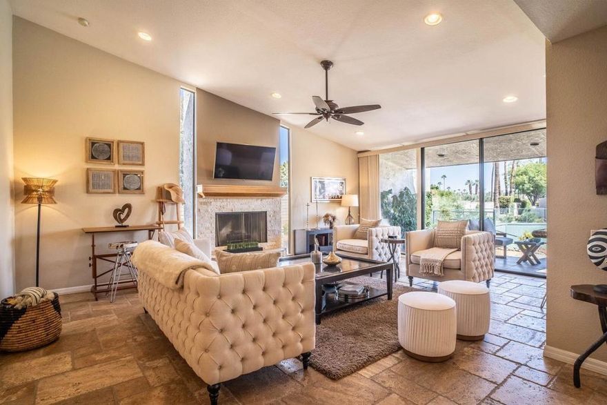 Welcome to Dorado Villas, one of the most private and desirable communities in Indian Wells.This beautifully updated residence showcases a sophisticated blend of travertine and wood flooring, elegant light fixtures, and an open, airy floor plan. The living room centers around a cozy fireplace and flows seamlessly to the formal and informal dining areas, a spacious bar, and soaring ceilings. Thoughtfully chosen furnishings create an inviting atmosphere, making each space feel like home--perfect for both relaxation and entertaining.Each bedroom offers its own private bath, generous closet space, and direct access to a secluded patio. The primary suite features an expansive walk-in closet. Outdoors, a large private patio provides plenty of room for dining and lounging, set just steps from the tennis courts and within walking distance of the community pool and spa.As a resident of Indian Wells, you'll also enjoy exclusive benefits such as preferred rates at the world-class Indian Wells Golf Resort, access to the BNP Paribas Open, fitness privileges at the Indian Wells Marriott, and generous discounts at local restaurants and venues.This home combines elegance, comfort, and resort-style living in one of the desert's most sought-after locations.