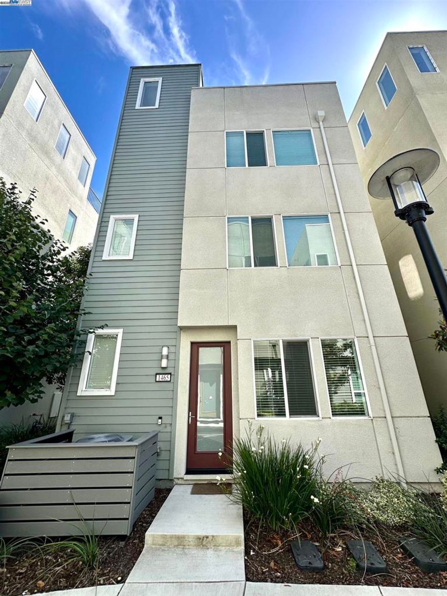 Discover your new home at 1465 Latitudes Way, a contemporary single-family residence offering the perfect blend of modern comfort and exceptional Bay Area convenience. Located in a desirable Richmond community, this home is designed for a seamless lifestyle, ideal for those seeking easy access to city amenities without sacrificing suburban tranquility.  This spacious residence boasts approximately 1,787 sq. ft. of interior living space. It features 3 bedrooms and 4 bathrooms (3 full baths, 1 half bath), providing ample space for family and guests. You'll enjoy a thoughtfully laid-out kitchen, comfortable living areas, and stylish, contemporary finishes throughout. A rare and exceptional feature is the private rooftop deck, perfect for entertaining, private relaxation, and enjoying the beautiful surroundings. The home also includes a dedicated two-car attached garage for secure parking and extra storage, and the flooring features a mix of carpet, hardwood, and tile for a warm and modern feel.  Living at Latitudes Way places you at the center of a vibrant and developing area with quick access to a variety of amenities. Enjoy proximity to Point Richmond with its charming historic village, local restaurants, cafes, and bars. Spend weekends hiking, biking, or enjoying nature.