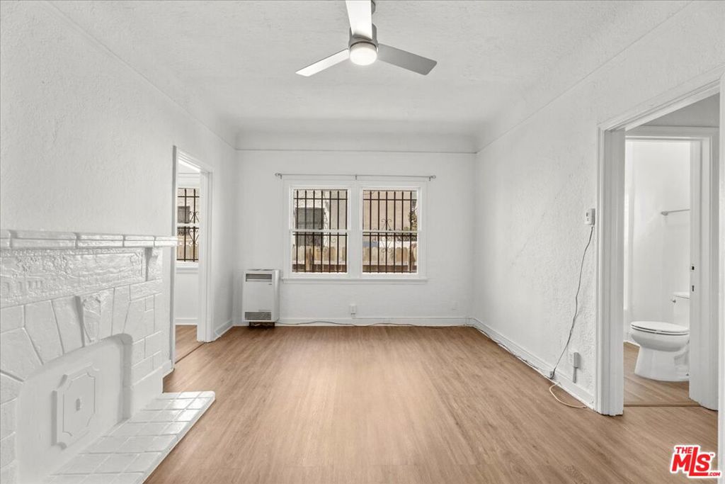 Bright and spacious 1 bedroom/1-bathroom newly renovated home with heat and ac, lots of natural sunlight, and a modern kitchen and bathroom. Prime Miracle Mile location, North of Wilshire Blvd, South of 3rd St, just a few blocks from the Grove and Pan Pacific Park. Living spaces feature brand new wood-like flooring, a modern ceiling light/fan, decorative fireplace, high ceilings, a walk-in closet and a separate dining area off the kitchen. Kitchen features white wood cabinetry, grey granite countertops and backsplash, fridge, stove/oven, a modern light fixture, and plenty of room for storage. Bedroom is spacious, has a window a/c, two closets, and a modern ceiling light. Bathroom features a pedestal sink, medicine cabinet, and a spacious shower/tub combo with white tile shower walls. Communal laundry room. Street parking. Enjoy all the best coffee shops, clothing stores, and trendy restaurants a few blocks away at the Grove. Short drive to Beverly Grove, Beverly Hills, West Hollywood, and Hollywood. Enjoy a luxury living experience in Prime Miracle Mile.
