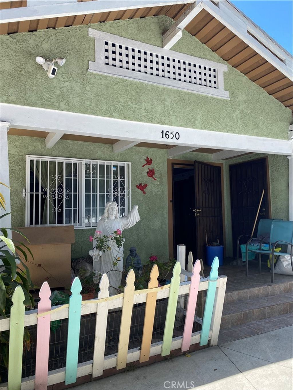 Photo of 1650 W 39th Place, Los Angeles, CA 90062 (MLS # RS26048897)