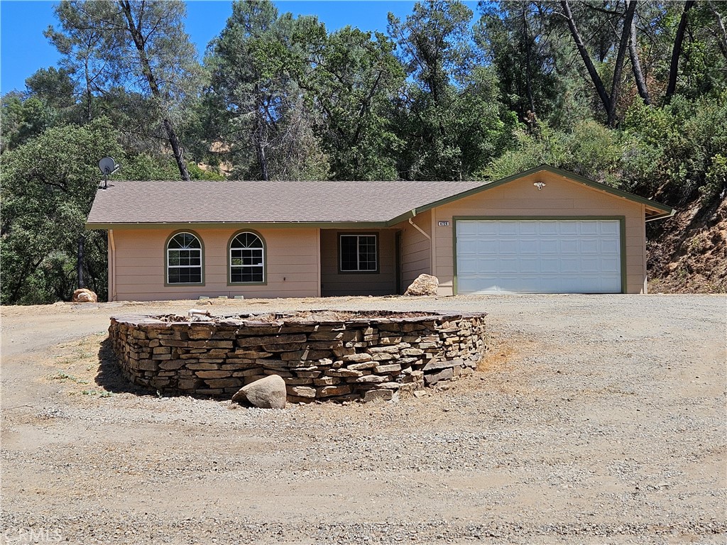 Whether you are an investor, a first time buyer, or someone looking for that vacation home in the hills, this home is for you! When you move into this home, you will find everything already done for you. New paint, new floors and more. You will love the views and enjoy your privacy. The three bedrooms are all nicely sized, and the living area is open to allow any style of living. When sitting on the patio, you can enjoy the morning sunrise and taking in the sounds of nature and the views of the high sierras. The outside watering system is already installed, and you have a blank canvas to work with when you decide how you want your landscaping to look. The large planter in the approach also includes a connection from the 1500 water tank for fire protection. Come and enjoy the slower life in the country.