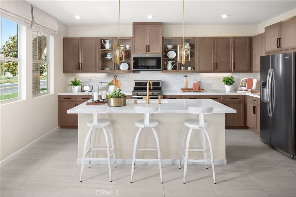 Brand new and move-in ready, this bright end-unit two-story home at Zinnia in The Preserve offers an ideal blend of comfort, efficiency, and smart design. Ask about limited-time incentives and flexible financing options that may help to reduce closing costs or monthly payments. With extra windows and abundant natural light throughout, this 3-bedroom + loft layout offers both style and functionality. Enjoy an open-concept Great Room and Kitchen with a center island, walk-in pantry, and direct access to a 2-car garage. A downstairs bedroom and full bath offer privacy for guests or a perfect home office. Upstairs, the airy loft provides additional flex space, and the spacious Primary Suite includes a generous walk-in closet and dual-sink bath. A conveniently located Laundry Room and additional secondary bedroom complete the upper floor. Built by Beazer Homes—named the nation’s #1 builder of DOE-certified Zero Energy Ready Homes—this home is designed for comfort, energy savings, and cleaner indoor air with its Indoor Air Plus certification. Please note that pictures are of model home.