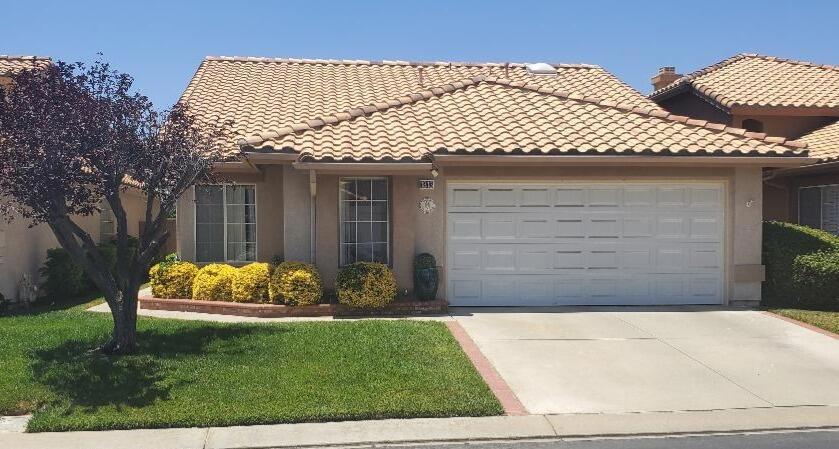 Come enjoy the active 55+ community of Sun Lakes with its resort style amenities and entertainment options, while living in your comfortable, well maintained and upgraded home. This Turnberry model, 2 bedroom, 2 bath, with office/den has been meticulously cared for. Recent upgrades include vinyl plank flooring throughout, fresh interior paint, recently upgraded air conditioning system, new water heater, restructured patio cover, to name a few. The family room with fireplace is open to the dining room and has a sliding door for direct access to the backyard patio. The Galley style kitchen includes a modest seating niche area and also includes direct backyard access. The spacious primary suite, to emphasize one more time, has direct backyard access, and includes a walk-in closet with immediate access to the double sink bathroom. The 2 car garage has an extended nook area, ideal for your golf cart and includes ample storage with cabinets and a pull-down ladder to utilize the large attic. Enjoy crisp mornings while relaxing in the backyard garden patio. A brief recap of the vibrant Sun Lakes Community; 2 golf courses, fitness centers, outdoor and indoor pools, 80+ social clubs, sports courts galore, weekly live entertainment, 2 restaurants, and the list goes on. This may rightfully become your best move ever! We welcome your viewing.