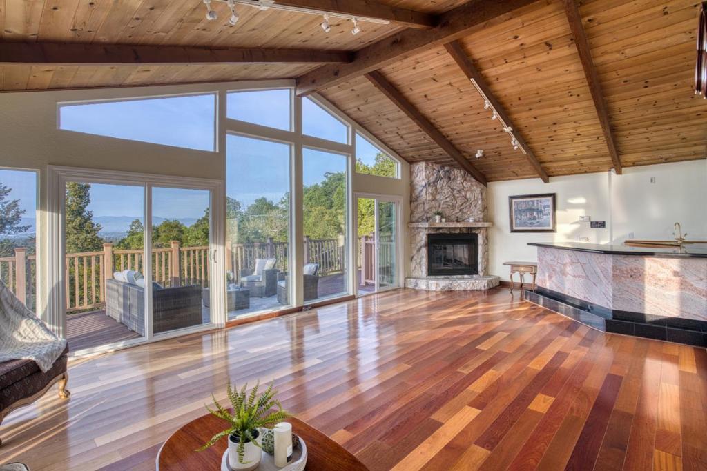 Welcome to your private sanctuary in one of the area's most coveted locations. This exceptional property showcases sweeping panoramic views of the hills and city skyline from multiple angles throughout the home. The primary bedroom and spa-inspired bathroom both offer stunning vistas, while expansive decks surround the house, bringing nature close each time you step outside. Enjoy a relaxing soak in the jacuzzi, cozy up by the fire pit, or host unforgettable gatherings at the built-in BBQ all with remarkable views as your backdrop. The generous lot also offers endless potential to add an ADU, tennis court, or resort-style pool. Just minutes from downtown Los Gatos, where vibrant shops, restaurants, and cafes await. This rare blend of seclusion, scenery, and opportunity offers the perfect setting to create your dream home!