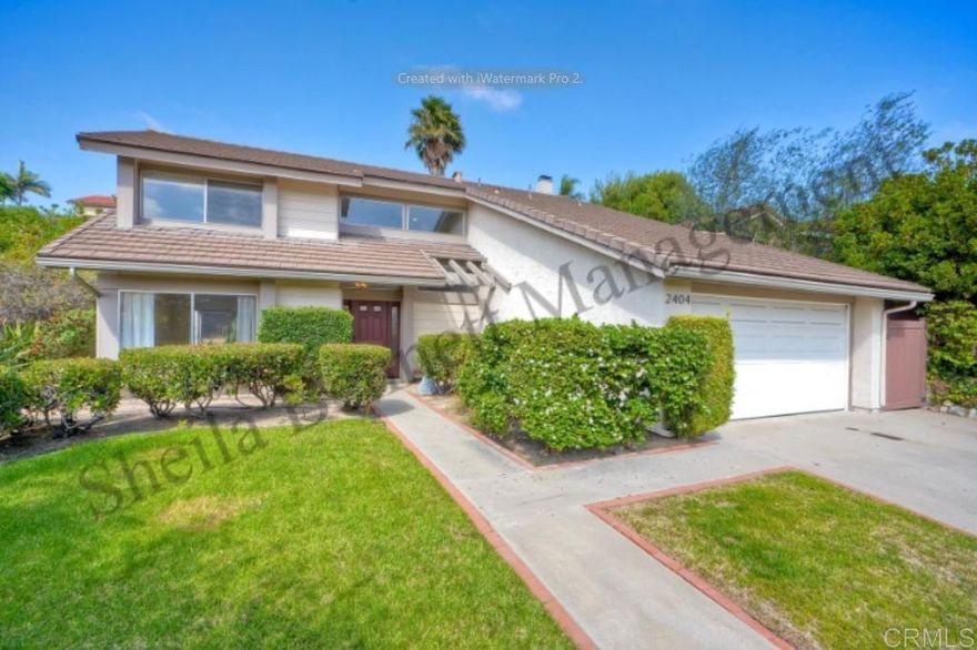 The two-story residence is located on a semi-cul-de-sac, just half a block from a park and conveniently close to shopping centers. Upon entry, the newer front door with privacy side window leads to elegant honey-colored wood flooring. The formal living and dining rooms are positioned to the left, while the family room and staircase to the upper level are to the right. The kitchen, centrally located between the dining room and family room, features updates including white cabinetry, grey quartz countertops and modern sink overlooking the backyard. The breakfast bar opens into the family room, which includes a fireplace, as well as access to the half bath and laundry area. The family room leads to a spacious, fenced backyard with a concrete patio, bocci ball court, and landscaped hill, creating a private retreat. Upstairs, there are four bedrooms. Three are positioned to the left alongside a fully remodeled bathroom. The master bedroom and en-suite bath are on the right; the master bath has been updated with tile, an espresso double-sink vanity with marble countertop, mirrors, and lighting fixtures. Window coverings throughout, new paint and carpet and heating and air conditioning were installed a few years ago. An outdoor shower is available for convenience after beach outings. All appliances available including refrigerator, washer and. The two-car garage has a pull-down storage area that can also double as a playroom.  This home is ideally situated for access to highly regarded public schools. A one-year lease. Tenants are responsible for all utilities and must maintain renters’ insurance. Pets may be considered with an additional rent. Credit check fee is $40 per adult applicant.
