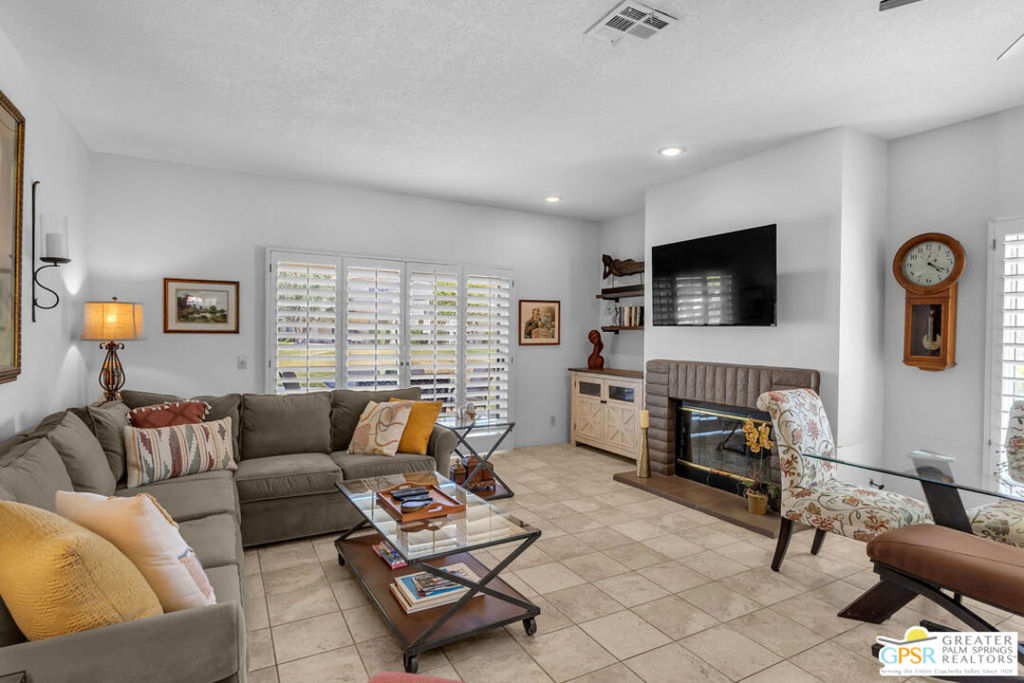 Resort-Style Living with Pool Views in Desert Falls CC! This 3BD/2.5BA lower-level beauty offers the perfect mix of comfort and luxury. The gorgeous kitchen has been fully remodeled with granite countertops, sleek cabinetry, and stainless steel appliances, complete with a cozy breakfast nook or sitting space. Bathrooms have also been updated for a modern feel. Tile flooring flows throughout the entry, kitchen, living areas, hallways, and bathrooms, carpet in 2 bedrooms. The condo is partially furnished, so you can move in and start enjoying it right away-artwork excluded. Step onto your private patio and soak in the peaceful views of the lush greenbelt and large community pool and spa-perfect for both relaxation and entertaining. The attached 2-car garage has lockable cabinets for additional storage. Short-term rentals are allowed, making this an excellent investment opportunity. Included in the HOA dues are access to 32 pools and spas, a fitness center, tennis, pickleball, cable, internet, landscaping, exterior maintenance, and 24-hour guard-gated security. Golf enthusiasts will love the semi-private, championship course, and the clubhouse offers dining and social events. Call to schedule your showing and experience the Desert Falls lifestyle today.