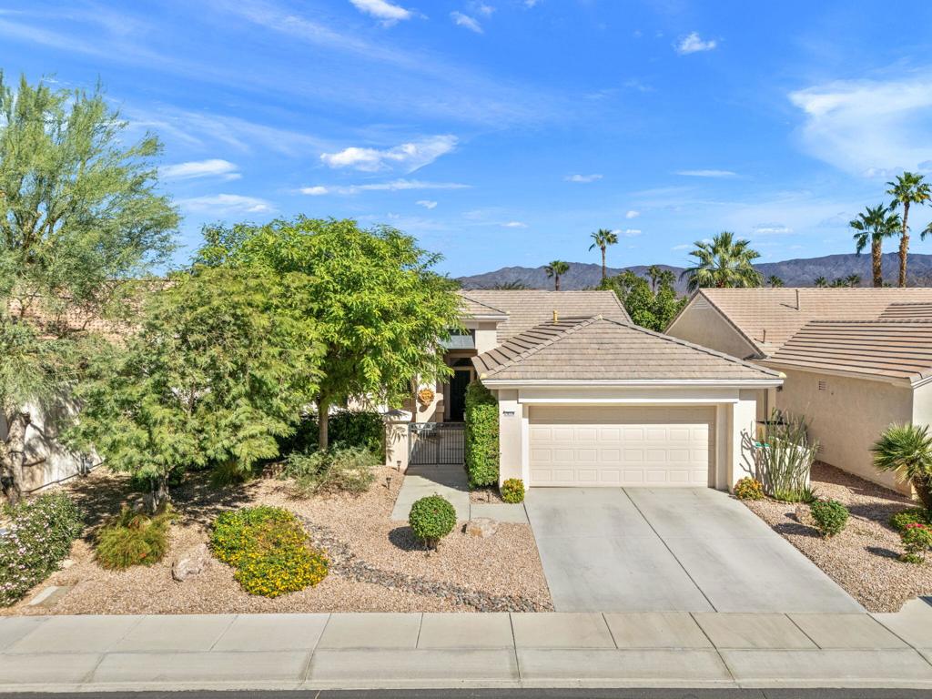 Sun City Palm Desert 55+ community.This Morocco is one of the most popular models, with high ceilings and transom windows, letting in plenty of light. The large entry courtyard is perfect for a sitting area that enjoys southern warmth in the winter. It has 2 bedrooms, 2 bathrooms, a den/office with a built-in office desk, and lots of natural light. Upgraded 12X24 tile was added in the main living areas and carpet in the bedrooms. The living room has a custom entertainment center and huge windows. The kitchen has newer stainless appliances, a kitchenette, and a center island. The laundry room has a utility closet, and the washer and dryer are included. The master bedroom has a bay window with a nice view of the beautiful private north-facing backyard. An extended 'Alumawood' cover makes it feel like another living space outdoors. The master bathroom has a custom walk-in tile shower, a private toilet room, a large walk-in closet, and a dual vanity. The guest bedroom is adjacent to the 2nd full bathroom and is very inviting. It has a 2-car garage and is extended with a golf cart nook. Lenox A/C was replaced in 2014. This is a must-see home, so don't miss it. SUN CITY PALM DESERT IS ALL ABOUT LIFESTYLE!! It has many clubs, activities, amenities, and low HOA dues. Play at 2 championship 18-hole golf courses and practice facilities, pickle ball, tennis, softball, bocci ball, an 18-hole miniature golf course, an honor library, arts and crafts, a ballroom for special entertainment, and 4 saltwater pools kept at 87 degrees with hot tubs. Enjoy 2 great restaurants, a martini/coffee bar, and even a post office. There is a newly renovated classy indoor/outdoor bar with fire tables to enjoy the awesome views and our beautiful desert weather..