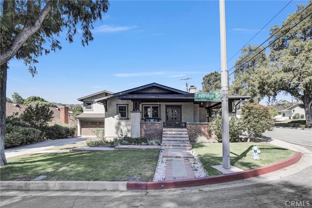 Nestled in the highly sought-after Mar Vista Heights, this charming Craftsman-style home seamlessly blends timeless character with modern updates. Featuring 3 bedrooms, 2 bathrooms, and original hardwood floors, the spacious layout includes a light-filled living room with a brick fireplace, a formal dining area with a unique built-in buffet, and an updated kitchen with soapstone countertops and stainless-steel appliances. The vaulted, wood-beamed family room opens through French doors to a wrap-around porch and expansive entertaining deck, overlooking the private backyard surrounded by tall privacy hedges on all sides. The private Primary suite offers a cozy fireplace, walk-in closet, recessed lighting, and a luxurious en-suite bath with a soaker tub. Additional highlights include copper plumbing, dual-pane windows, newer HVAC, updated electrical, and an oversized garage with abundant storage. A home automation dream, most of the dimmable LED lights and ceiling fans are Lutron controlled, as well as the motorized window shades. There is ethernet cabling wired to each room. This lovingly maintained home is located in a close-knit neighborhood and is truly move-in ready. Don’t miss this rare opportunity to own a piece of architectural history in one of the area’s most beloved communities!