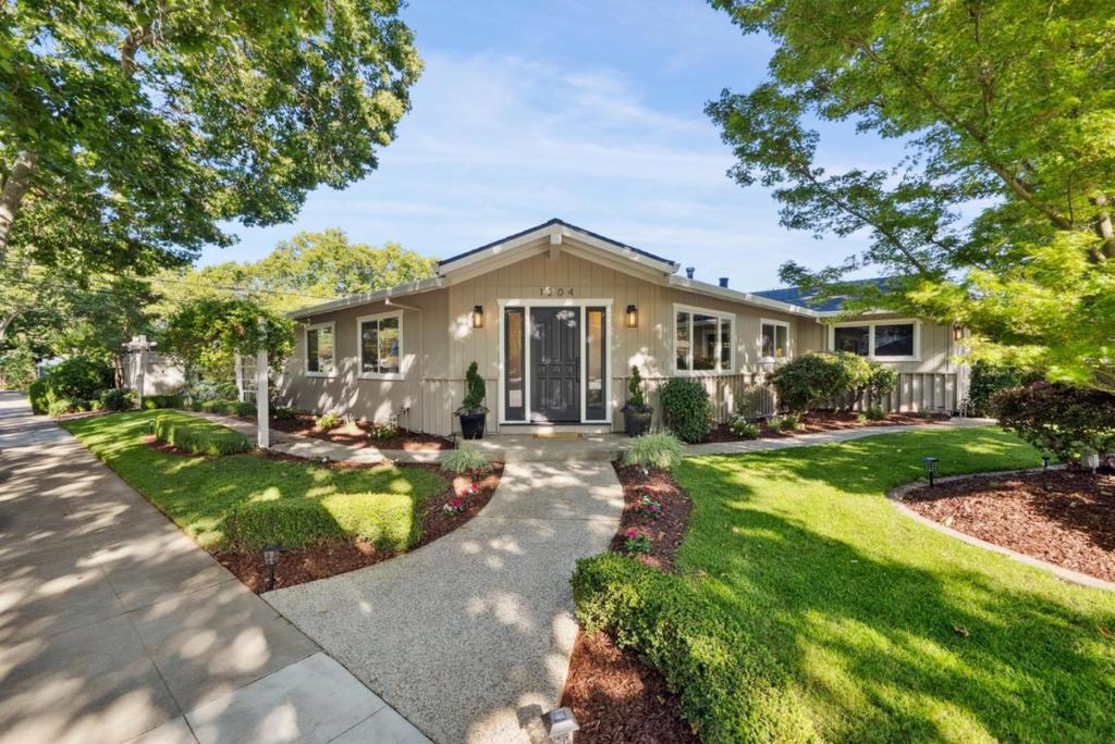Expertly renovated and move-in ready, this stunning 4-bedroom, 3 full bathroom home offers 2,535 sq.ft. of designer living space, a spacious 504 sq.ft. 2-car garage, and sits on an expansive 8,176 sq.ft. lot in one of Willow Glen's most coveted enclaves- "the Caminos". Just a short stroll to Downtown Willow Glen's vibrant Lincoln Avenue, this home blends custom luxury finishes with everyday comfort. Formal living and dining rooms feature SPC floors, picture windows, designer chandeliers, and recessed lights. The show-stopping great room offers vaulted beam ceilings, a linear fireplace with floor-to-ceiling tile, wraparound floating mantel, and double sliding glass doors to the backyard. The chefs kitchen boasts a 6-burner American Range cooktop, KitchenAid fridge, porcelain island, chevron backsplash, and custom cabinetry. The spacious primary suite offers French doors to the backyard, walk-in closet with organizers, and a spa-like bath. Enjoy multiple outdoor spaces including a private courtyard with pergola and a backyard patio perfect for entertaining. New roof, paint, lighting, SPC & porcelain floors, plus three beautifully remodeled bathrooms. Stroll to Lincoln Avenue's shops & restaurants, walk to the Willow Glen Farmer's Market, walk to schools and parks!