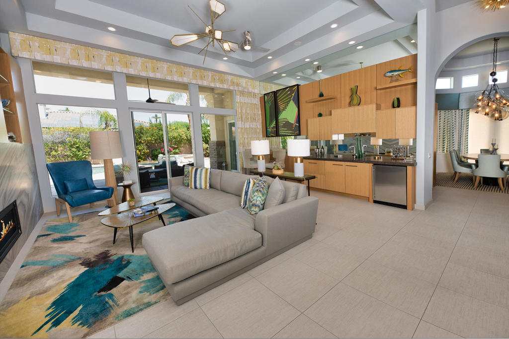 Discover a true masterpiece of contemporary design and luxury living in this exclusive home behind the gates of Ivy League Estates. Featuring just under 4,000 sq ft of interior living, this 5 bedroom & 5 bathroom custom-renovated gem is a stunning fusion of artful finishes & design. Ivy League Estates is less then one mile from Eisenhower Medical. This beautiful home boast two spacious master suites located on opposite sides of the home for ultimate privacy, both open to the resort-style outdoor oasis. Immerse yourself in the custom saltwater pool and spa, relax by the fire pit, or entertain guests under the covered outdoor kitchen and BBQ area, all while taking in the breathtaking mountain views. Lush landscaping completes the serene setting, creating the perfect backdrop for outdoor living and entertainment. Enjoy the privacy of the front courtyard from the large casita/guest house complete with a fireplace, kitchenette & Murphy bed. Inside, the chef's kitchen is equipped with double ovens, a built-in refrigerator, and opens to the grand great room. The fifth bedroom is currently a dedicated theater with elevated seating and full blackout curtains offering the ultimate movie-watching experience, rivaling any professional theater. With a 3-car garage and every modern convenience, this home is the perfect playground for full-time living or a luxurious desert retreat. Experience the ultimate in privacy, design, and lifestyle in the heart of Rancho Mirage. Don't miss the chance to make this unparalleled property your own!