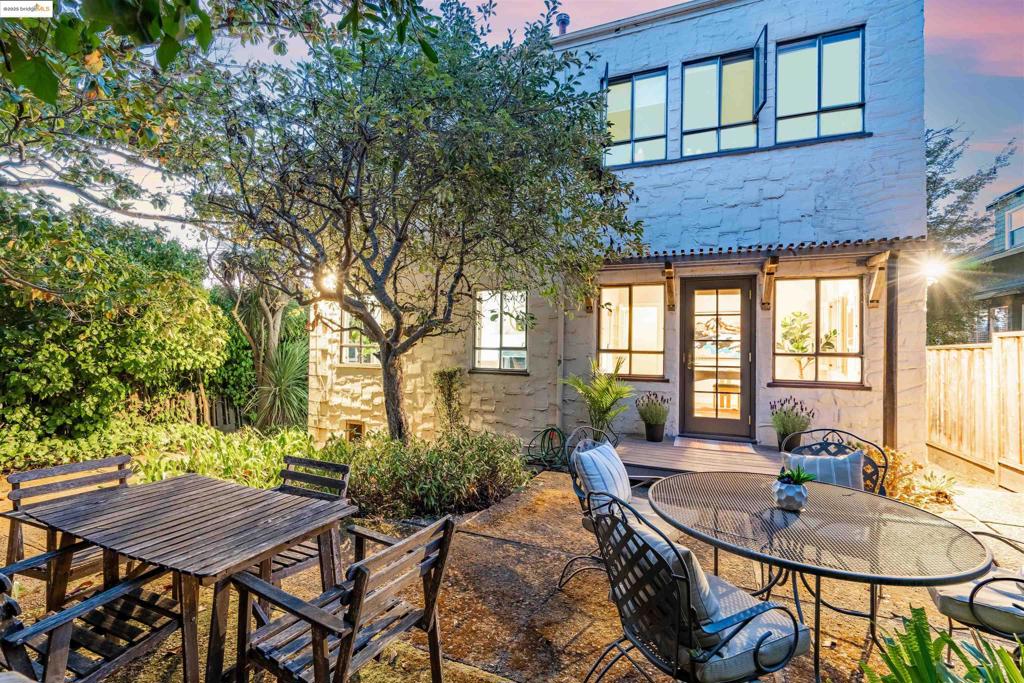 This spacious ground-floor condo is one of Rockridge’s most distinctive offerings, blending classic charm with modern updates. It’s the only unit in this four-unit building with direct access to the shared patio, a lush outdoor space that feels like an extension of the home. The kitchen includes brand-new appliances (2025) and a cozy dining nook, while a flexible bonus room off the living room can serve as a dining area, home office, or second bedroom. Natural light floods the space through large windows, creating a warm and inviting atmosphere. Additional highlights include a beautifully updated bathroom, a gas fireplace, a private one-car garage with a 110V EV charger, separate storage, serene garden views, and access to a shared roof deck boasting stunning San Francisco and Bay views. With low HOA dues and a prime location near transit, shops, and dining, this condo is a rare Rockridge gem.
