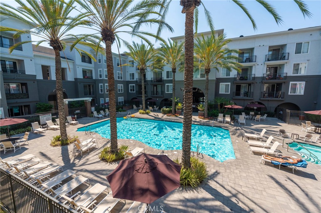 Upgraded 2-bedroom condo in the sought-after Stadium Lofts community. The modern kitchen features granite counters, stainless steel appliances, and a refrigerator that stays. The open living room is filled with natural light from the sliding glass door that leads to a balcony with an awesome pool view. The primary bedroom offers a private bathroom and walk-in closet, while the second bedroom is set on the opposite side of the home for added privacy. Other highlights include ceiling fans, air conditioning, in-unit laundry with washer and dryer included, and two reserved parking spaces. Stadium Lofts offers great amenities including a fitness center, heated pool and spa, sauna, game room, conference room, BBQ areas, and landscaped courtyards. All this, just minutes from Angel Stadium, Honda Center, Disneyland, The Block at Orange, Anaheim Garden Walk, and the Amtrak station.