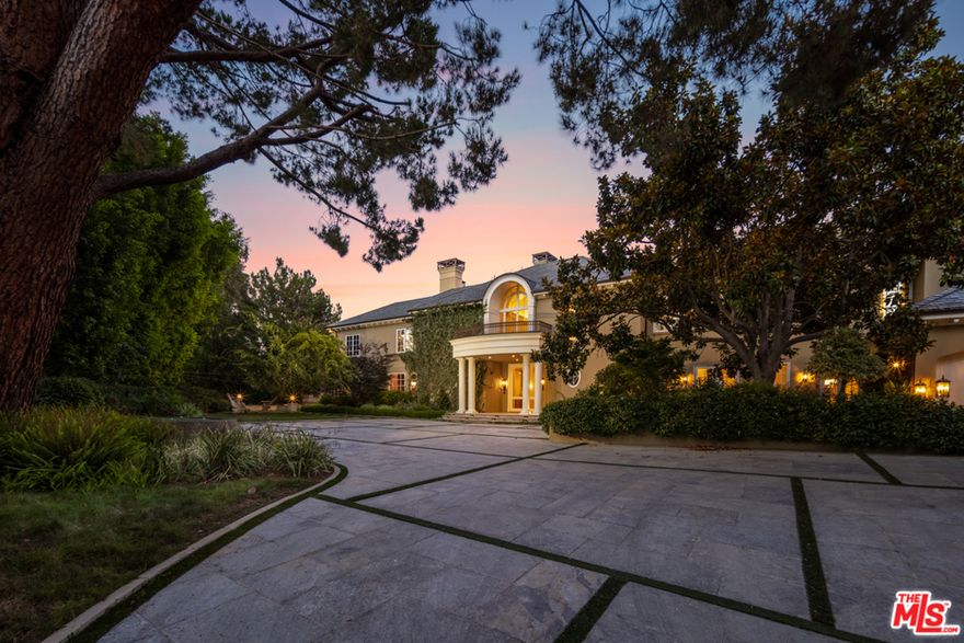 Located in the prestigious, guard-gated, celebrity enclave of Beverly Park South, this 13,500 sq ft Georgian estate is sited on just over 2 enchanting acres with breathtaking city and canyon views. Selected and built by the developer as his own personal residence, and equipped with every modern and luxury amenity imaginable, this exceedingly secure & private estate is one of only a few Beverly Park properties affording sweeping city lights views. Luxury living spaces include state of the art gym with steam room and sauna, plush movie theater, wood-paneled library, and Master Bedroom wing with dual bathrooms and closets. Designer details include artisan crown molding, parquet wood flooring, and high-end, imported materials. The verdant grounds include rolling lawns, sparkling pool and spa, & several "secret" gardens making this one of the most unique and desirable offerings in Beverly Park.