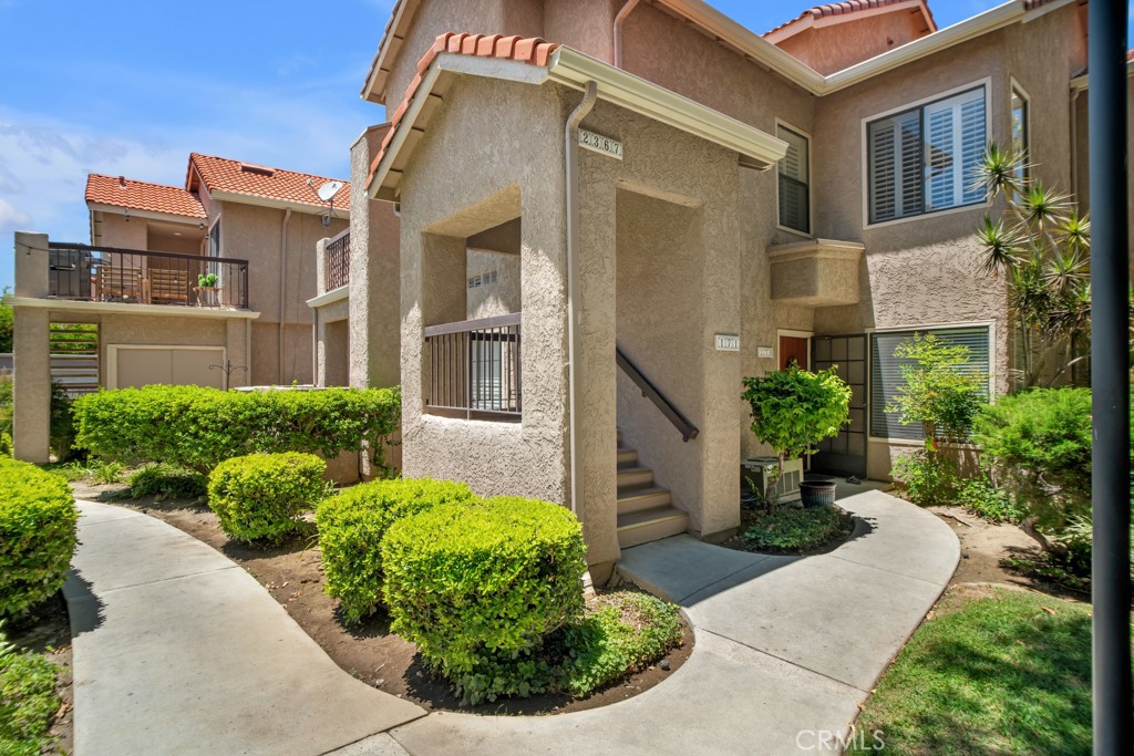 Now's your chance! Freshly priced and waiting for its new owner. This beautiful upper-level condominium is located in one of East Simi Valley’s most sought-after FHA & VA approved communities, Spring Time, and is one of the very desirable quiet end units. Here are just a few of its many other fine features: You’ll step into a flowing open concept floor plan that is in “Move-In-Condition” with a designer paint scheme, plantation shutters, and easy care laminate flooring. The spacious living room is bathed in natural light from a multitude of windows and has a high pitched ceiling. The family’s cook is going to appreciate the updated kitchen’s abundant cabinets, ample counters with stylish tile back-splash, durable deep basin stainless steel sink, 2023 purchased built-in stainless steel appliances, refrigerator, gas range with stainless steel ventilation hood, and the convenience of the adjoining dining area with lighted ceiling fan and direct balcony access. Both bedrooms have roomy mirrored closets; The main suite also has a well appointed private bathroom. A total of 2 bathrooms. The stackable washer & dryer are staying in the functionally located laundry area. Central heat & air for year-round comfort Newer water heater, 1 garage parking space and 1 assigned uncovered spot. HOA pays for water and refuse removal. You’re going to experience “Resort-Style-Living” enjoying the community’s lush greenbelts, sparkling pool, and soothing spa that is just steps from the unit. Great location close to schools, parks, grocery stores, shopping, great restaurants, MetroLink station, and the 118 freeway. Call now for all of the details and I’ll gladly arrange your private tour.