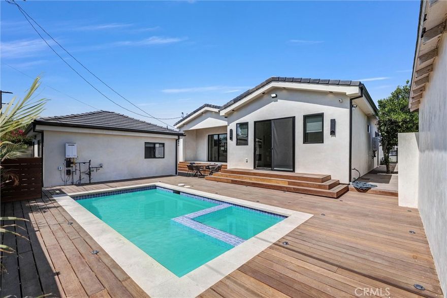 Newly Built Modern Luxury Home with Private ADU in Prime North Hollywood

Welcome to this stunning, beautifully furnished newly constructed modern residence in the heart of North Hollywood. Designed with high-end finishes and thoughtful detail throughout, this luxurious property offers 4 bedrooms, 4.5 bathrooms, plus a private 1-bedroom, 1-bathroom ADU—perfect for flexible living.

Step through the oversized front entry into a light-filled interior featuring soaring 10-foot ceilings and an open-concept layout that blends comfort and contemporary style. Two spacious en-suite bedrooms are located at the front of the home, offering ideal space for additional bedrooms, home offices, or creative use.

The chef’s kitchen is a showstopper, complete with custom light-toned cabinetry, an oversized center island, and top-tier stainless steel appliances. A sleek wet bar with matching cabinetry, open shelving, and a mini-fridge enhances the entertaining experience. The kitchen flows effortlessly into a spacious living room featuring a modern fireplace and built-in surround sound system. Large pocket sliding doors lead to the backyard, creating a seamless indoor-outdoor lifestyle.

The primary suite offers a true retreat, with its own fireplace, walk-in closet, and direct access to the backyard. The spa-like primary bath includes dual vanities, an oversized rainfall shower, and a private water closet for ultimate relaxation and privacy.

Additional highlights include a generous laundry room with a sink and built-in storage, custom lighting throughout, and premium finishes that elevate every space.

Enjoy the California lifestyle in a beautifully designed backyard featuring a wood deck, sparkling swimming pool, and relaxing hot tub—ideal for lounging or entertaining. This home also features security cameras. 

The detached ADU includes a stylish kitchenette with stovetop and microwave, a living area, one bedroom, and a full bath—offering versatile, private living space to suit your needs.

Located in a prime North Hollywood neighborhood, close to shops, restaurants, studios, and major freeways.



Available now for short-tern or long term-lease—experience modern luxury living at its finest.