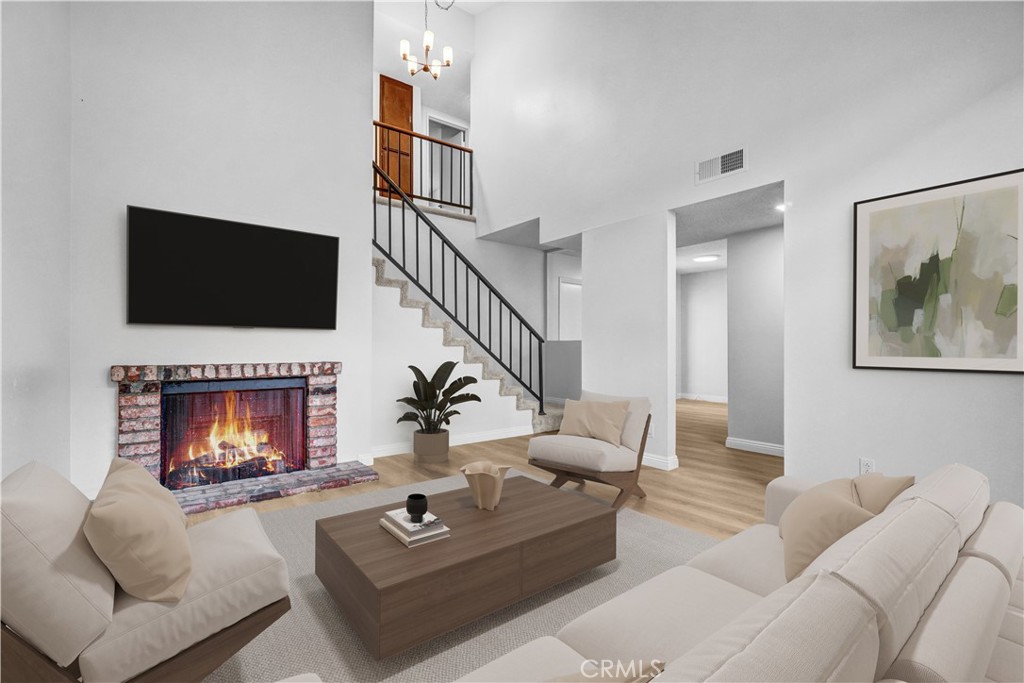 This desirable condo offers 2 spacious bedrooms and 2.5 bathrooms in Baldwin Park. It offers enhanced privacy and an abundance of natural light, creating a bright and airy atmosphere throughout. There are many recent upgrades including new luxury vinyl plank (LVP) and carpet, new kitchen, new bathrooms, new interior paint... and more. Inside, you'll find LVP flooring throughout the main living areas & bathrooms and carpet in the bedrooms, stairway, & upstairs hallway. The layout features a dedicated dining area with direct access to both the private patio and the attached garage ~ perfect for convenient everyday living. Enjoy a comfortable family room complete with a fireplace & vaulted ceiling ~ perfect for relaxing or entertaining. The primary suite includes a walk-in closet and an en-suite bath for added comfort. Additional highlights include an attached garage, abundant natural light, and a quiet location. HOA covers water, trash, exterior, and maintenance such as roof, stucco, and fire insurance.