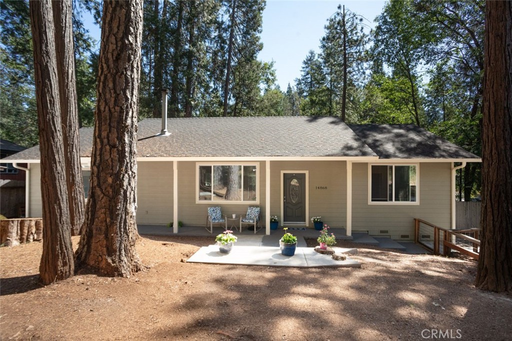 Tucked away in the quiet hills of Magalia, this newer-built home checks all the boxes, spacious, updated, and move-in ready. With two spacious bedrooms, both with walk-in closets, and two full baths, there's room to spread out in comfort. The open-concept layout feels bright and airy thanks to tall ceilings, recessed lighting, and big windows that bring in the views. The kitchen shines with granite counters and a seamless flow into the living area, perfect for entertaining or cozy nights in. Step out onto the private balcony and take in the peaceful forest views. Enjoy the ease of a long, paved driveway with plenty of parking. This home offers the perfect balance of modern living and mountain charm.