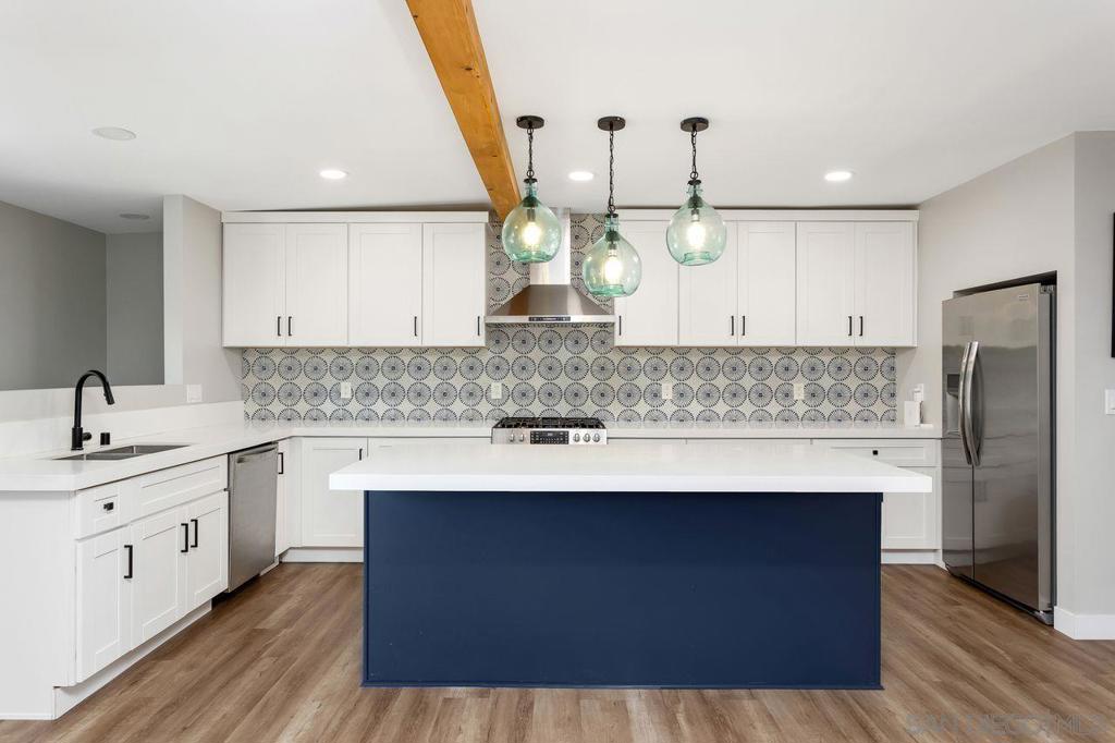 Discover this beautifully remodeled turnkey 3-bedroom, 2-bathroom Vista single-family home, thoughtfully upgraded in 2022 with a new roof and premium finishes throughout. The bright, open layout showcases custom-cut quartz countertops and ENERGY STAR® certified appliances, blending modern style with efficiency. On clear days, enjoy peek-a-boo ocean views from the unique rooftop oasis—ideal for relaxing or entertaining. Additional features include a whole-house water filtration system, a newer water heater, and mini-split air conditioning for year-round comfort. Conveniently located just minutes from downtown Vista, Brengle Terrace Park with its tennis and pickleball courts, and only 9 miles from Carlsbad’s beaches, this move-in-ready gem offers the perfect balance of comfort, quality, and modern living—just unpack, settle in, and enjoy everything Vista living has to offer! Heating & cooling via energy-efficient mini-split system.