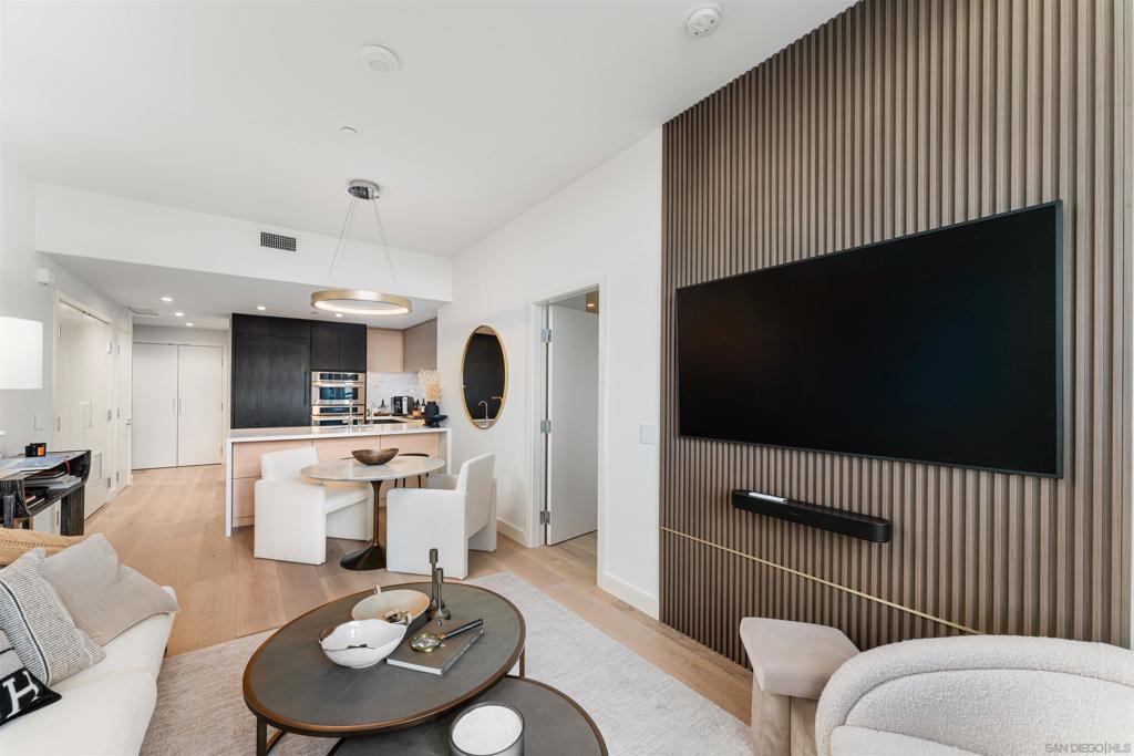 Residence #401 is a rare 1 BR/1.5BA residence at Savina, Downtown San Diego's newest luxury condo high-rise! This modern condo has upgrades like hardwood flooring throughout, custom wall paneling, motorized shades, and even features an oversized private roof deck that extends the home for outdoor living! Ideally located between the Waterfront and vibrant Little Italy, Savina features over 24,000 sqft of hotel inspired amenities such as 24hr security, a resort-style pool/spa, a massive state-of-the-art gym, yoga terrace, BBQ deck, social lounge, EV charging and more! Available fully furnished + WiFi included!