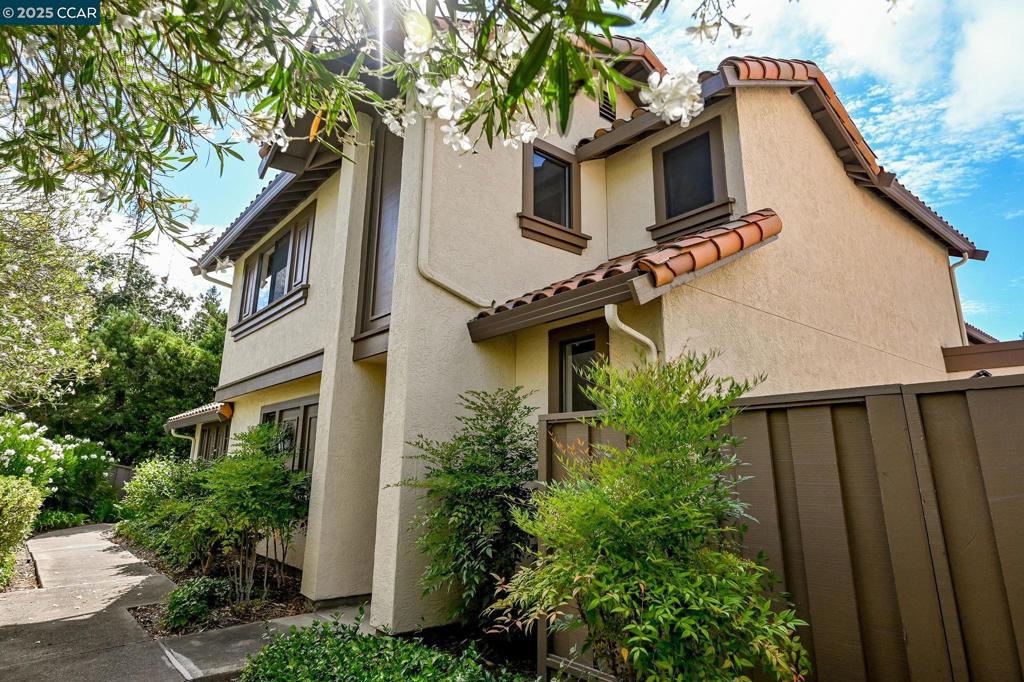 Perfectly situated near downtown Walnut Creek, BART, and scenic trails, this beautifully updated home offers a light-filled layout, premium privacy, and unmatched convenience. Located in one of the community’s most desirable spots, the residence features 3 spacious bedrooms, 2.5 baths, and stunning upgrades throughout. The main-level primary suite boasts a beautifully updated bath. Open kitchen offers dine-in opportunity while flowing easily to dining room and living room. Dining room with beautiful lighting and built in cabinets overlooks spacious living room- with vaulted ceilings, fireplace and sliding doors to outdoor private patio—perfect for outdoor dining or relaxing. Upstairs, two additional bedrooms and a full bath provide comfortable space for family or guests. Additional highlights include lovely flooring, updated bathrooms, spacious closets, in-unit laundry, a two-car attached garage, and central HVAC. Enjoy resort-style community amenities including a pool, spa, tennis court, greenbelt, and guest parking. All within top-rated Walnut Creek and Acalanes school districts (buyer to verify). This is the one you’ve been waiting for!