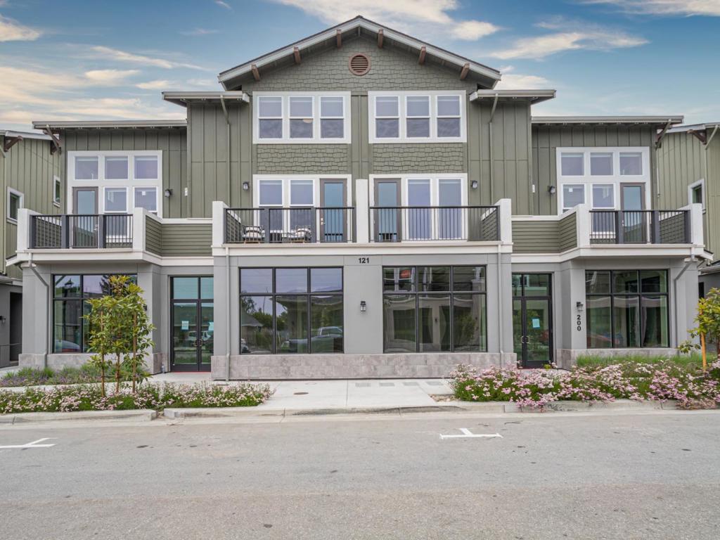Welcome HOME to the Aptos Village, a thoughtfully planned community in the HEART of Santa Cruz County. Featuring a pedestrian-friendly town square, this community offers a neighborhood grocery store, quaint coffee shops, tasting rooms, boutique retail, and multiple dining destinations. The largest floorplan in Phase 2, this specific home site also features ocean views from multiple rooms. The spacious great room steps out onto a private balcony overlooking Aptos Village Way with peaks of the Pacific Ocean on the horizon. A guest bedroom and full bathroom are located off the living room. Upstairs are two suites- a primary and a junior suite- both equipped with walk-in closets. All New Construction, the Builder has included a full suite of stainless steel appliances, washer and dryer set, and window coverings at no additional premium. These homes are truly move-in ready. Bring your boogie boards, bring your mountain bikes and get ready to explore long stretches of sand at Seacliff Beach and even longer stretches of trails at the Forest of Nisene Marks State Park. It takes a Village and we can't wait to welcome you to your NEW HOME.