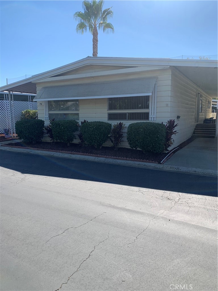 Nice location in this 55 plus community and the second person can be 18 years or older to live here. This large two-bedroom two bath home can be fixed up a little, but space and location is great. A huge master with attached bath and a very large lot and deck to enjoy with your friends and family. The community has lots of great amenities to enjoy like heated swimming pool, large spa, clubhouse with pool tables, TVs, a gym and library not to mention monthly community events so you can be a part of this great community. All buyers must apply with the park to be approved with 680 plus credit scores. must make 3x the space rent in provable monthly income and pets must be 20 lbs and under.