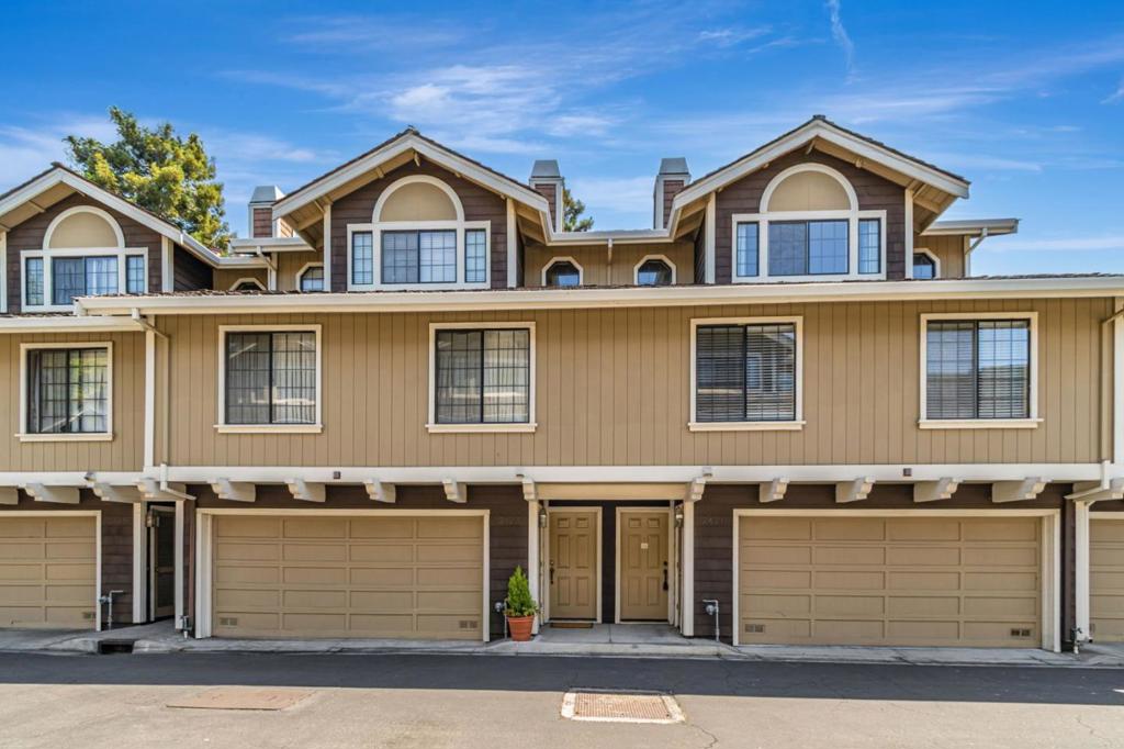 Welcome home to this move-in ready, tri-level townhome in the Santa Clara Redwoods Community. The living room has plenty of natural sunlight, vaulted ceilings, gas starter fireplace, and a slider leading to your private patio. Just off the living room is the dining area with another slider to the patio and access to the open kitchen. Stainless steel appliances, including a refrigerator, electric stove/oven, vented hood, and dishwasher, are included with the home. (no warranties) Up a few stairs you will find the laundry area with washer & dryer, a hall bath with tile floor & shower over tub as well as 2 bedrooms with generous closet space. Up the final set of stairs is a landing with built-in storage cabinetry overlooking the living room, and an expansive primary suite. Double doors open to a light filled bedroom with a gas started fireplace and drop down bathroom with dual sinks, additional closet space and a shower over tub. The attached two car garage conveniently leads right into the home. Centrally located just off of San Tomas Expressway (next to Pruneridge Golf Club) and in the middle of 280, 880, and Lawrence Expressway with quick access to Westfield Valley Fair and Santana Row