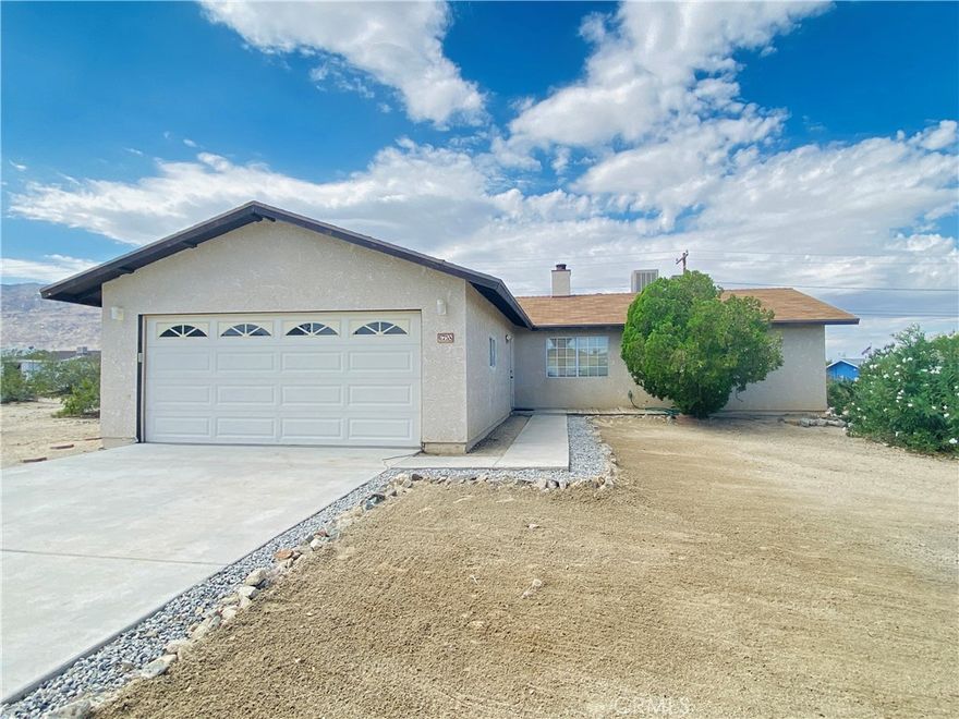 Cozy Home with a Beautiful View! This nice home in 29 Palms has a panoramic rear view where you can see the desert and mountains all around. The kitchen has a granite counters, a garden window, and comes with all the kitchen appliances you need! There is a dining area off the kitchen, and the living room has a gas fireplace for ambiance. You’ll love the large walk-in closets in all bedrooms, ceiling fans throughout, and dual cooling and natural gas FA heat to keep you comfortable all year. There are no immediate neighbors, so there is extra peace and quiet. It’s close to Joshua Tree National Park and the Marine Base, making it a great spot for adventure or work. Some minor cosmetic repairs are needed, but this home has lots of potential and charm.