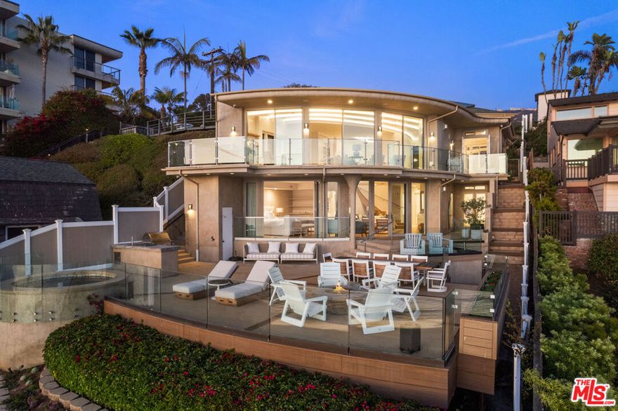 Perched above the pristine Totuava Beach with private steps leading directly to the sand, this gated estate embodies the pinnacle of coastal Orange County luxury. Situated on a rare 21,000-square-foot lot, the property features a newly remodeled main residence and a separate guest house, both designed to maximize breathtaking, unobstructed views of the Pacific Ocean, Catalina Island, and vibrant sunsets. The main residence offers 3 spacious bedrooms, an open-concept layout, and walls of glass that seamlessly blend indoor and outdoor living, allowing the striking blue waters to serve as your everyday backdrop. Designer finishes elevate every corner, creating a sophisticated yet inviting retreat. The detached guest house is equally impressive, boasting its own private entrance, a full kitchenette, one bedroom, and a beautifully appointed full bathroom. Crafted with the same attention to detail as the main residence, it offers privacy and comfort for guests or extended family. What truly sets this estate apart is the private beach bungalow nestled directly on the sand. Complete with running water and electricity, this one-of-a-kind space is perfect for unwinding after a day by the ocean or entertaining with ease. Outdoor living is a dream with a fire pit, spa, built-in barbecue area, and multiple seating areas designed for gatherings of all sizes. Ample parking is a rare treasure on Laguna Beach's coastline, but this property exceeds expectations with a 4-car garage and a massive motor court accommodating up to 6 additional vehicles. From the panoramic views to the luxurious amenities, every detail of this property has been thoughtfully curated for effortless entertaining and serene beachfront living.