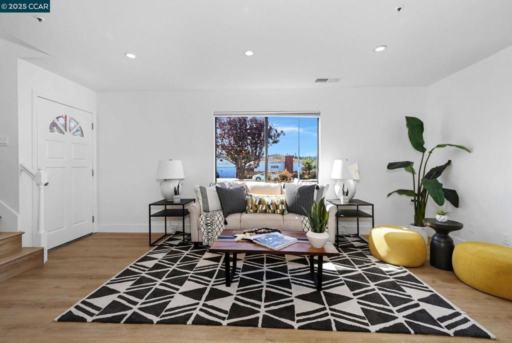 Terrific TURN KEY Townhome on Castro Valley Border! Feels like NEW with interior renovation featuring: White Oak LVP flooring, Fresh Interior Paint, Recess & LED Lighting. Sparkling Kitchen with soft close cabinets, Quartz counters, eye catching backsplash & custom shelves, New stainless appliances Stove, dishwasher, refrigerator, sink & faucet. Spacious floor plan offers tons of natural light thru out. Living room has attractive tile faced fireplace; Inviting Dining Area with sliders to patio for relaxing. Upstairs TWO Huge Ensuite Bedrooms each with its own private lovely Full Bathroom. Plus Primary bedroom has 2 closets and plenty of room for work space set up etc. Enjoy outside terrace with views of hills. Rarely seen unit has its own enclosed 2 Car Garage. Additional convenient Inside Laundry and Extra Closets for Storage. Location is ideal minutes to HWY 580/680 & BART, close to both downtown Castro Valley & Hayward, shopping, restaurants, etc. Truly don't miss seeing this one!