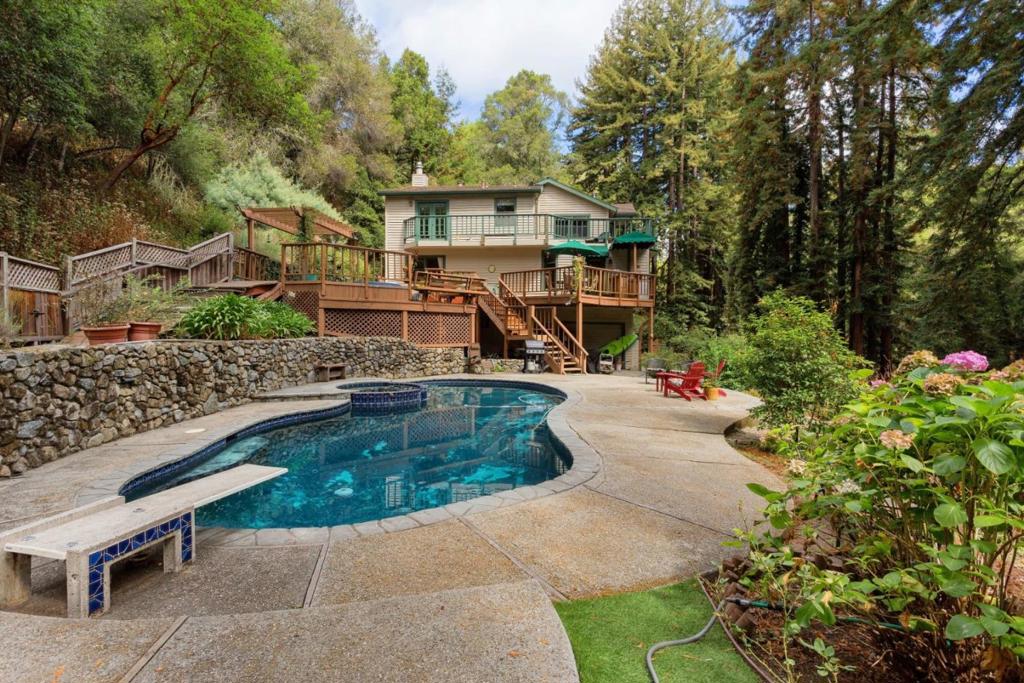 Gorgeous and private estate sanctuary. On near 2 acres surrounded by redwood trees, your private oasis awaits, built in pool and spa. This must see home has 3 bedrooms, 2 bathrooms, 2 + car garage and a wrap around deck to enjoy the views.Tucked away at the end of a private street, minutes to Hwy 17, shops, schools and restaurants in the sought after Granite Creek Neighborhood. You will see deer, wild turkeys and a variety of birds in the yard. There is no Hwy 17 noise thanks to the ridge up from the house.
