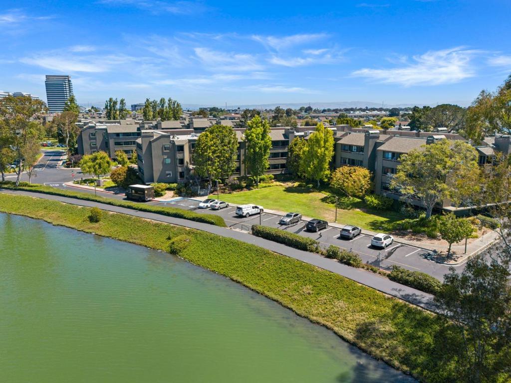Welcome to Foster City Waterfront Living! Located in the highly sought-after Spinnaker Cove community, this rarely available 2-bedroom, 2-bath condo, approx. 1,499 living sqft, offers a bright, open floor plan designed for both comfort and flexibility. A generous living and dining area opens to a private balcony with serene views, while the updated kitchen features stainless steel appliances and abundant storage, making it ideal for cooking and entertaining. The primary suite includes a versatile den, perfect for a home office, fitness space, or convert it into a third bedroom if desired. A spacious second bedroom and full bath complete the layout. This home has been lightly lived in as a family second home, which is reflected in its excellent condition. Residents of Spinnaker Cove enjoy low-maintenance living with HOA exterior upkeep, beautiful landscaping, & prompt preventative maintenance throughout the complex.