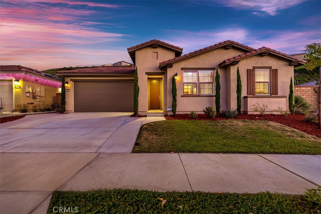 This is your chance to own the most affordable home in the prestigious Sierra Bella community! This exceptional 3-bedroom, 3-bath single-story residence is more than a home; it's a testament to thoughtful design and functional elegance. Every detail of this home has been curated to offer a lifestyle of comfort and distinction, featuring bespoke elements you simply won't find anywhere else. Step inside and discover a custom-made loft/bonus room, a one-of-a-kind feature perfect for a kids' play area, study space, or media room. The oversized laundry room has been thoughtfully converted into a functional home office, providing a quiet and dedicated workspace. You'll also appreciate the convenience of a whole-house water softener system. The kitchen is a chef's delight, with a huge walk-in pantry that offers tons of storage. The large primary bedroom includes a massive walk-in closet, and you'll find walk-in closets in all bedrooms, ensuring everyone has plenty of space. The upgrades continue outside with a professionally fully landscaped backyard. The yard features beautiful stamped concrete and a patio cover, creating the perfect setting for outdoor dining, entertaining, and relaxation. Beyond your doorstep, the Sierra Bella community offers multiple parks with breathtaking views, providing a beautiful backdrop for your daily walks and family outings. Don't miss this opportunity to get into one of Corona's most desirable communities at an unbeatable price!