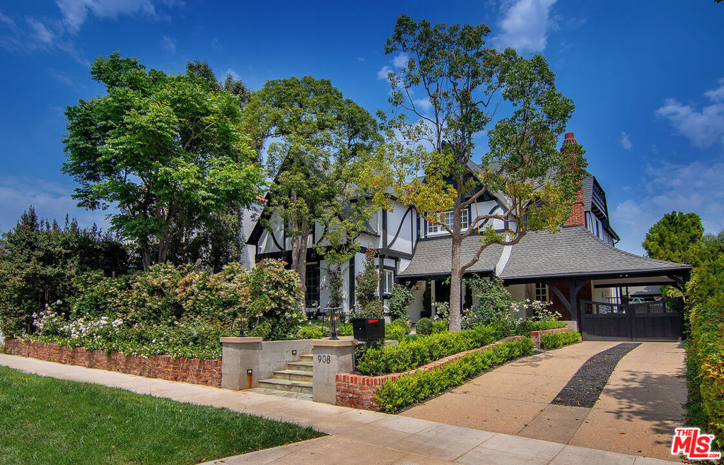 Nestled in the heart of the coveted Little Holmby neighborhood and within the prestigious Warner Avenue School District, this beautifully preserved Tudor Revival home seamlessly blends timeless architectural character with modern upgrades. Rich hardwood floors, elegant period details, and abundant natural light flow throughout the home, including a formal living room with coffered ceilings, recessed lighting, and a striking marble fireplace. A dramatic staircase and welcoming foyer set the tone for the home's graceful layout, which includes a serene primary suite with a walk-in closet and luxe en-suite bath, plus two additional family bedrooms. The converted garage offers a flexible bonus spaceideal as a home office, gym, or studiowhile custom window treatments, built-in shelving, and updated lighting enhance the home's functionality and style. Surrounded by lush landscaping and classic curb appeal, this home offers privacy and sophistication in one of the most desirable locations.