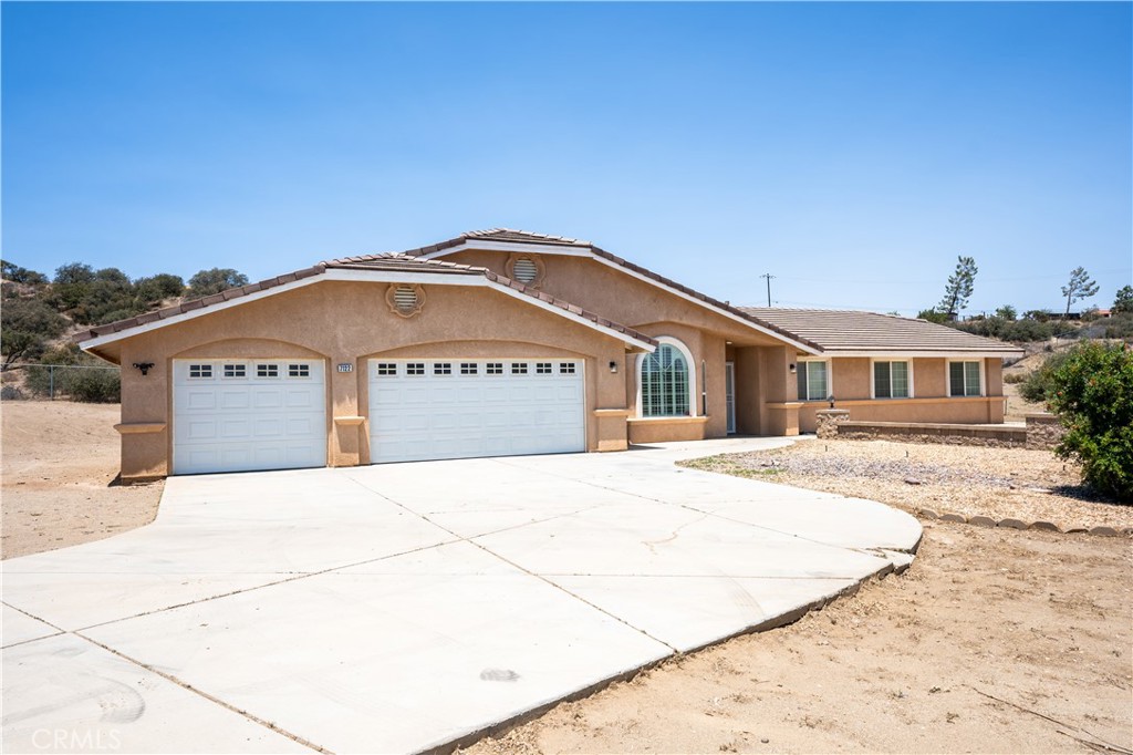 **** USE GOOGLE MAPS for directions. Apple Maps will take you to the wrong location****
NO private viewings until after open house this weekend June 29th
Welcome to the cutest modern farmhouse in the High Desert—where comfort, charm, and convenience come together.
Move-in ready and perfectly located for commuters, this serene property offers exceptional access without compromising privacy and tranquility.
Step inside to discover a beautifully designed interior featuring updated quartz countertops and custom mint green cabinets with an gold finishes, giving the home a warm, rustic elegance. The stainless steel appliances and walk-in pantry make the kitchen as functional as it is stylish.
Stay cozy year-round with a wood-burning stove that efficiently heats the entire home, helping to lower your winter energy bills. The spacious master bathroom offers a private retreat, complete with a soaking tub, separate shower, and double sinks. A large laundry/mud room with custom mint green cabinetry adds both charm and practicality.
Exterior highlights include:
A three-car garage
Low-maintenance landscaping
A covered patio in a peaceful, naturally private backyard surrounded by mature oak shrubs
Two sheds for additional storage (20x20 shed has power)
A long concrete driveway for ease and convenience
Fully enclosed with a 6-foot chain-link fence for added privacy and security
Solar panels for new owner to take over to save on electricity bill
This property blends modern comfort with farmhouse charm and offers everything you need to live the High Desert lifestyle in style. Don’t miss your opportunity to call this one-of-a-kind home yours!