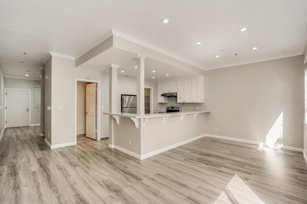 Welcome home! Quiet and bright north facing unit inside of the community. South facing windows in dining area. Kitchen space with modern laminate flooring throughout. Remodeled open concept kitchen with white quartz counters, stainless steel appliances, large sink, and large walk in pantry. 1/2 bath downstairs. Master bedroom suite featuring updated double vanity with quartz counters and tub with shower. 2 more bedrooms perfect for home office, playroom, or kids room. Updated guest bath includes tub and shower enclosure with glass door, and quartz countertops. Mirrored closet doors in all BR's. Spacious storage room in garage with elevator from parking level. HOA amenities include pool, jacuzzi, and recreation room. Gated and covered garage parking. Minutes to Sunnyvale Community Center, Ponderosa Park, Apple Campus, Google shuttle, Downtown Sunnyvale, Target, Whole Foods, Farmer's Market, and Caltrain station. Best priced 3 bedroom condo in Sunnyvale!