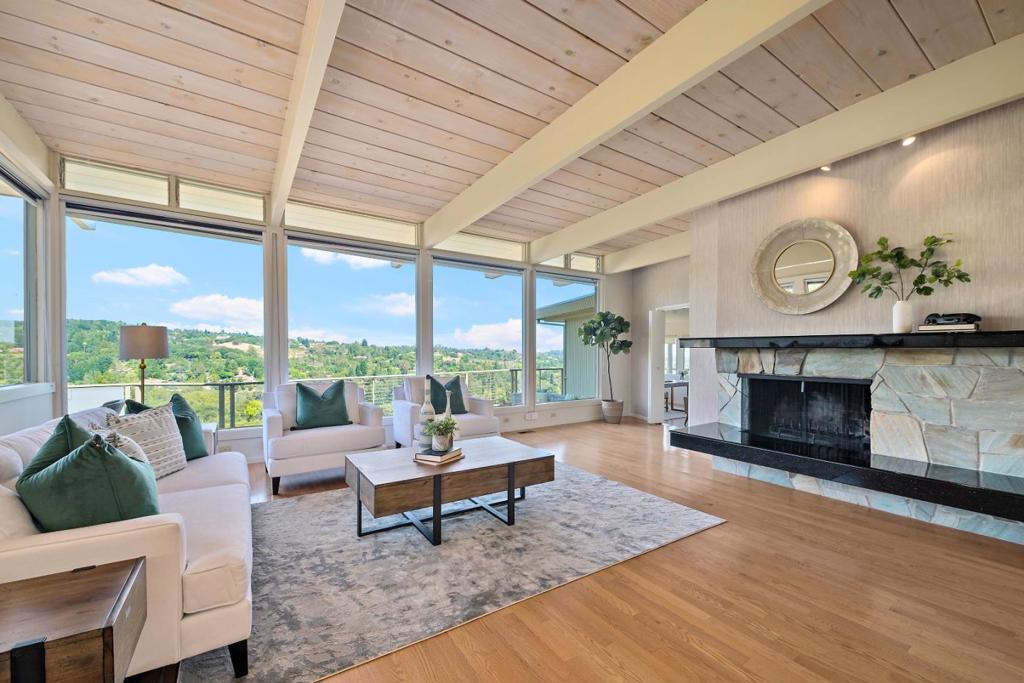 This elegant Los Altos Hills home sits on an ideal, close-in location with spectacular views spanning from downtown San Francisco to the South Bay. Classic and timeless, with mid-century modern inspiration, this stunning home offers impressive living square footage on a private lot of approximately 46,174+/- SF. Walls of windows, soaring ceilings and sliding glass doors create a graceful feeling of true indoor-outdoor living. The homes 7 bedrooms, media/workout room and 4.5 baths are ideally arranged over multiple levels for the utmost in flexibility. New 200 Amp electrical panel, paint and updated landscaping. Top Los Altos Schools include Bullis Gardener, Egan Middle and Los Altos High.
