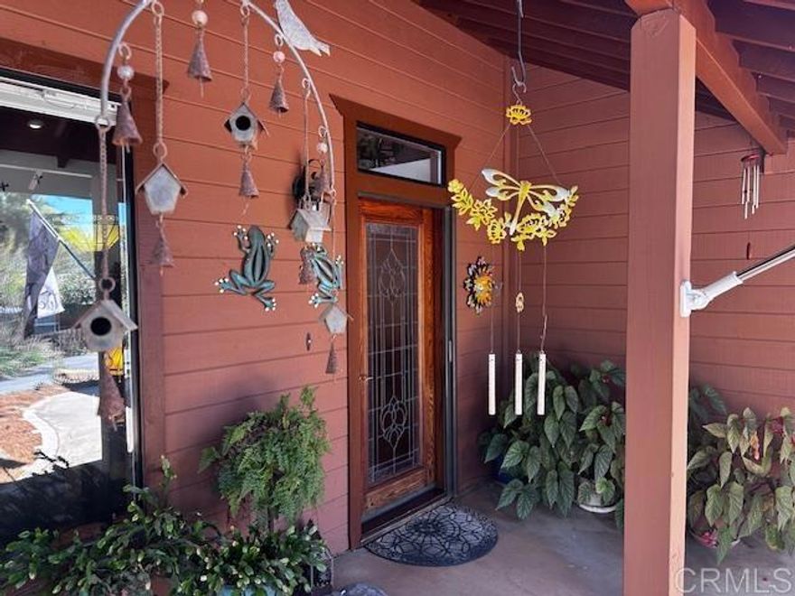 This is a great custom-built home on 2/3 acre!  No water or sewar bills and because of solar and battery back-up very low SDG@E cost. Quiet neighborhood with mountain views.  Plenty of parking, bring your RV, boat and toys.  This open concept split-level home is perfect for entertaining. Step into the living room with a beautiful rock fireplace and wood beam ceiling. Modern Electric blinds in the living room.  Large dining room with sliding door access to the outdoors. The large kitchen has modern appliances and includes a movable island. Just off the dining room is a multipurpose loft area above the garage.  The master bedroom is large with a private bath and mirrored closet doors run entire length of one wall.  Two additional bedrooms are roomy with mirrored closet doors as well.  All bedrooms have sliding door access to patio areas.  Enjoy afternoon BBQs in several outdoor patio areas along with mountain views and wildlife.  Other important features: Electric entry gate, Solid oak cabinets, Nice spa, Paid in full solar with automatic battery backup, Portable solar generator, One year-old central heat and air conditioner, Two large storage sheds, Whole house fan, Complete water filtration system, Property is fully fenced, Water well with two reservoir tanks, Septic system, Four miles to the town of Lakeside, Two miles to the Barona Casino, 30 minutes to the beach, 7 minutes to Lake Jennings. This is a must see!!