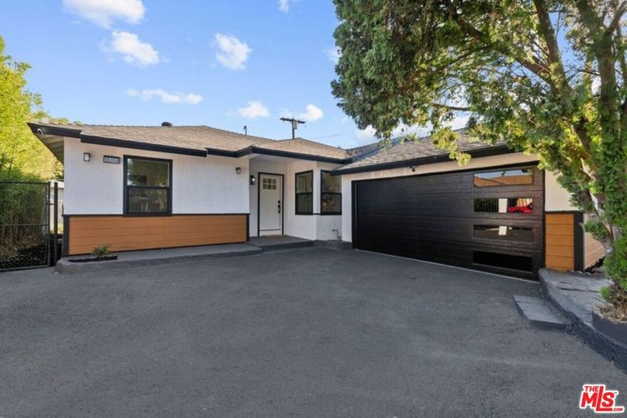 Welcome to the ultimate turnkey experience! This stunning, fully-gated modern home on a sprawling corner lot in Van Nuys offers unparalleled privacy and function perfect for a first-time buyer or growing family. Step into a bright, open-concept layout where the fully remodeled kitchen is the show-stopping heart of the home. It features a gleaming quartz waterfall island, top-of-the-line stainless steel appliances, and custom cabinetry with smart built-in USB/outlets making entertaining effortless. A formal dining area flows seamlessly from the kitchen. The versatile floor plan boasts a spacious primary suite with a luxurious en suite bath, plus two additional, well-sized bedrooms. Both bathrooms have been completely renovated for a spa-like feel. Enjoy a clean, contemporary aesthetic with new waterproof vinyl flooring, recessed lighting, and modern fans throughout. This home adapts to your life. A versatile bonus room can easily serve as a studio, playroom or fourth bedroom, complemented by a dedicated home office for remote work. The expansive, private backyard is a tranquil canvas with mature trees, ideal for al fresco dining under thoughtful dusk-to-dawn lighting. Multiple lounge areas throughout the front and back yard for maximum potential of this expansive corner lot. Every major system has been updated for comfort and efficiency: newer central HVAC (w/ Nest), a new 200-AMP electrical panel, updated plumbing, newer shingle roof, and double-pane tinted windows. Instant curb appeal is provided by the freshly painted exterior, newly paved driveway, and modern garage door. The garage is already updated with new drywall, paint, sensor lights, and an epoxy floor, making it perfectly poised for an easy ADU conversion. With the new 200 amp electrical panel and plumbing in place, you can quickly unlock potential rental income or create a private guesthouse. Parking is plentiful with a fully-gated driveway. Don't miss this opportunity to own a completely renovated Van Nuys gem!