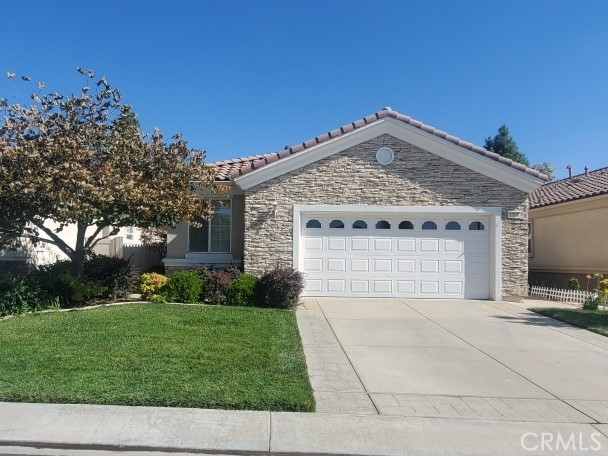 Charming "Princess" model on a quiet cul-de-sac in Solera, a 55+ community in Beaumont. Mountain views from the front and back yards! Private back yard, with artificial grass, low voltage yard lights and extended flagstone patio. This cute 2 bedroom, 2 bath home includes an office/den, plantation shutters, tile in the halls, crown molding, custom "slide-out" lower kitchen shelving, and a special walk-in shower in the master bathroom. Basic cable TV paid through HOA. Solera at Oak Valley Greens offers resort-style amenities designed for comfort and connection. Residents enjoy a spacious clubhouse with a fitness center, indoor walking track, arts and crafts rooms, billiards, and a library. Outside, you'll find a sparkling pool and spa, tennis and pickleball courts, and scenic walking trails—all next to a beautiful 18-hole golf course.